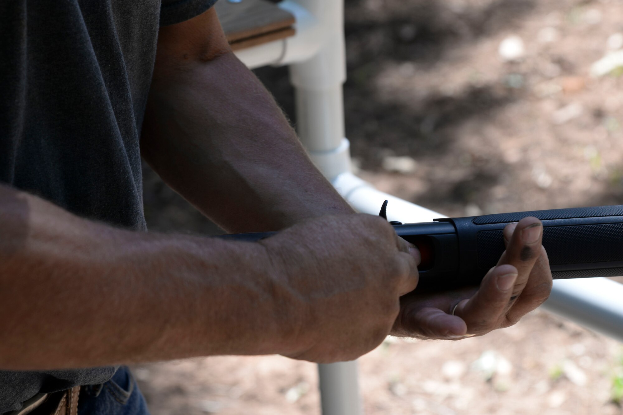 Otis Kimmons, 2nd Force Support Squadron Outdoor Recreation aid, loads ammunition into a shotgun at the Red Chute Shotgun Sports Club on Barksdale Air Force Base, La., Sept. 14, 2015. The club offers the complete shotgun shooting experience in the forms of trap, wobble trap, skeet, five-stand and sporting clays. (U.S. Air Force photo/Senior Airman Jannelle Dickey)