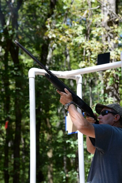 Otis Kimmons, 2nd Force Support Squadron Outdoor Recreation aid, shoots a shotgun at the Red Chute Shotgun Sports Club on Barksdale Air Force Base, La., Sept. 14, 2015. Kimmons took advantage of the new sporting clays range that grants shooters the closest opportunity to realistic hunting by providing an array of target trajectories, speeds and angles. (U.S. Air Force photo/Senior Airman Jannelle Dickey)