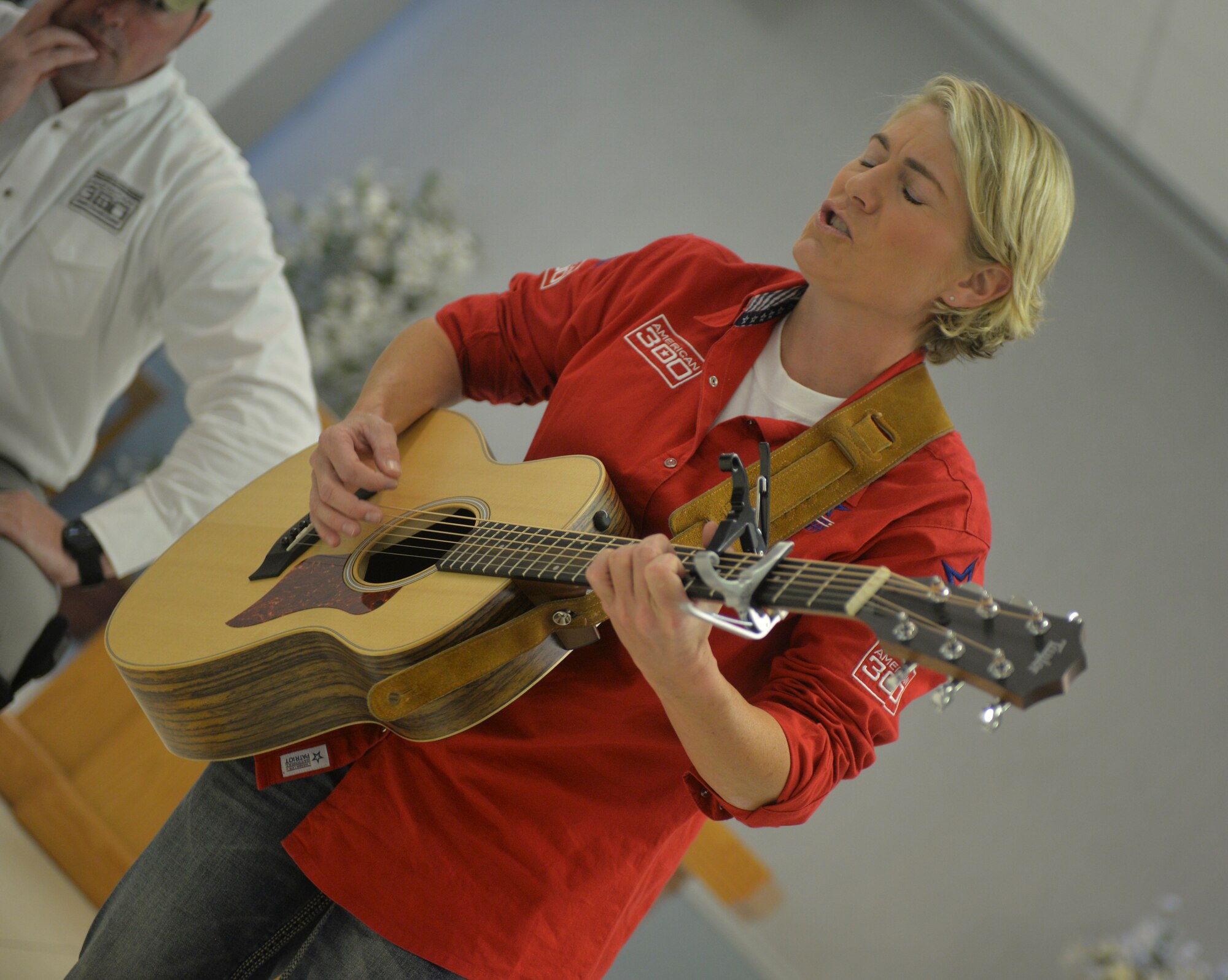 U.S. Army Chief Warrant Officer 2 Jen Housholder, a UH-60 Blackhawk pilot, sings for Airmen at Barksdale Air Force Base, La., Sept. 10, 2015. In addition to being a wounded warrior, Housholder is also an accomplished musician and the lead singer of Hous Band. She aims to create music that evokes thought, reflection and action.  Housholder sang “Stay with me,” a song from her most recent album, which was written about the challenges service members face when coming home from combat and re-integrating into civilian life. (U.S. Air Force Photo/Airman 1st Class Mozer O. Da Cunha)