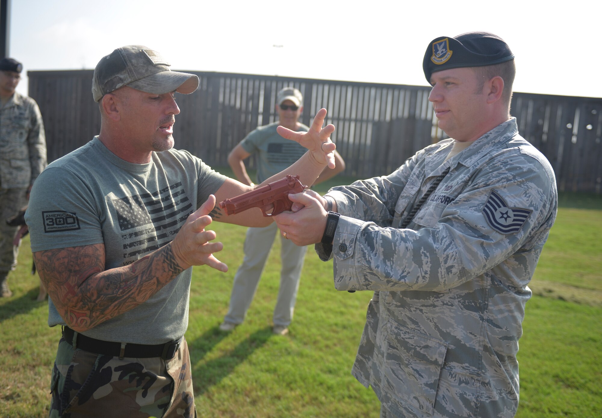 Shannon Ritch, mixed martial artist, instructs Tech. Sgt. Joe Hayes, 2nd Security Forces Squadron kennel master, on disarming techniques at Barksdale Air Force Base, La., Sept. 10, 2015. Ritch made his debut in the ring in 1991 and since has fought in 175 mixed martial arts matches in a period of 20 years, competing in at various locations around the world. (U.S. Air Force Photo/Airman 1st Class Mozer O. Da Cunha)