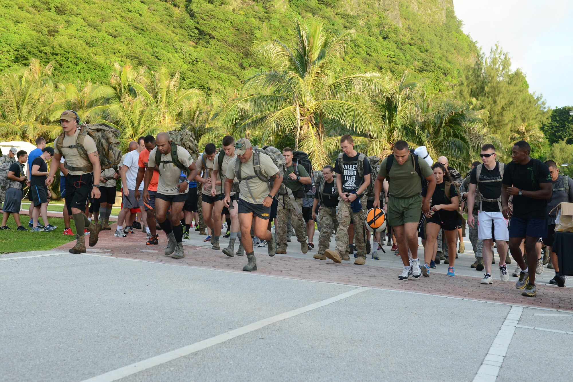 Participants start the race during the POW/MIA memorial ruck march Sept. 16, 2015, at Tarague Beach on Andersen Air Force Base, Guam. Approximately 100 participants attended the ruck march to honor prisoners of war and service members missing in action. (U.S. Air Force photo by Airman 1st Class Arielle Vasquez/Released)