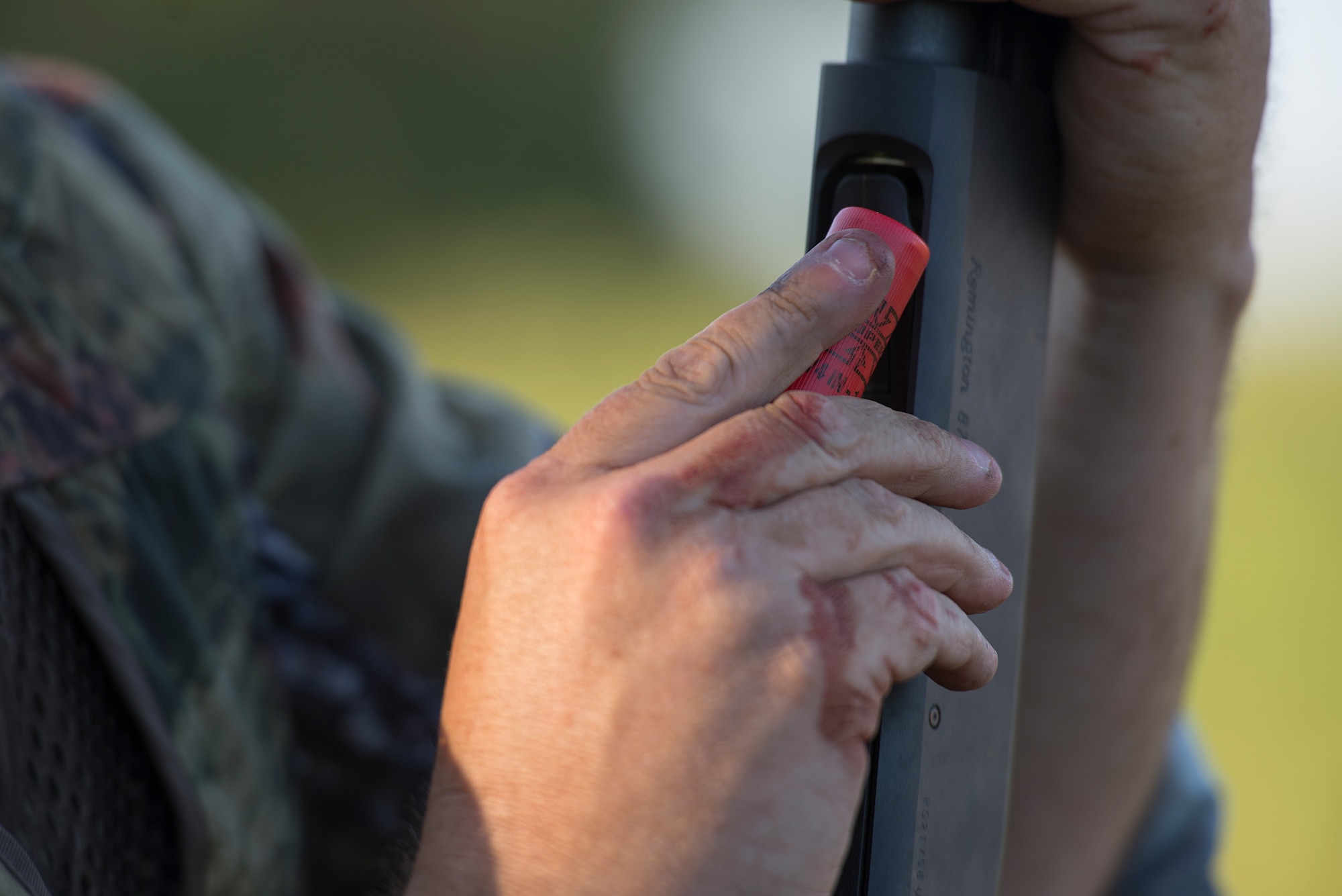 Tech. Sgt. Mike Meares, 82nd Training Wing photojournalist, loads a shotgun shell to his weapon during the 11th Annual Dove Salute in Henrietta, Texas, Sept. 12, 2015. The Dove Salute welcomed Airmen to the community with a hunt and Texas-style steak feast on the Birdwell and Clark Ranch, with a closing thank you from the ranchers. (U.S. Air Force photo by Senior Airman Kyle Gese/Released)