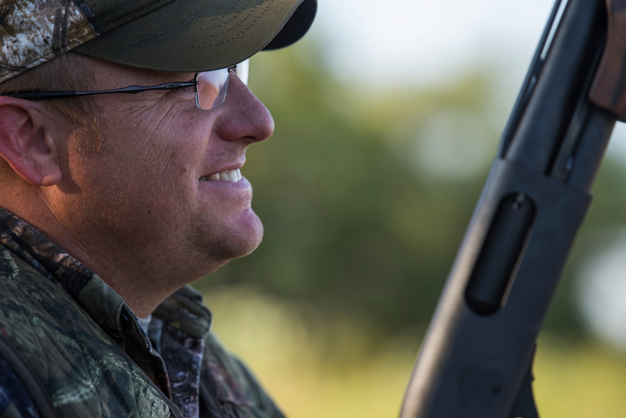 Tech. Sgt. Mike Meares, 82nd Training Wing photojournalist, waits for a flock of dove to get closer during the 11th Annual Clay County Dove Salute in Henrietta, Texas, Sept. 12, 2015. The Dove Salute provided Airmen with shotguns, ammunition, hunting grounds and closed with a Texas-style steak dinner on the Birdwell and Clark Ranch. (U.S. Air Force photo by Senior Airman Kyle Gese/Released)
