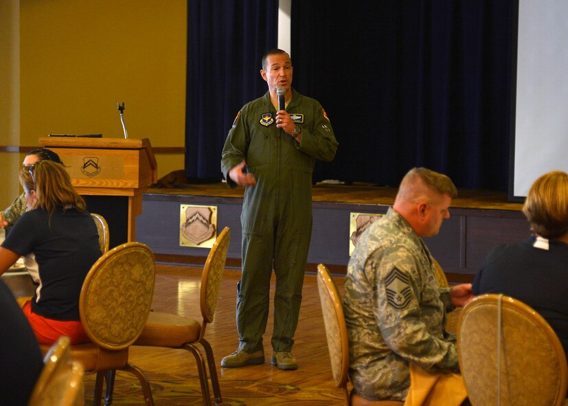 Brig. Gen. Scott Pleus, 56th Fighter Wing commander, speaks with the Dover Air Force Base honorary commanders during their visit at Luke Air Force Base, Ariz., Sept. 16, 2015. Pleus spoke to the honorary commanders about how they are the key to highlighting the Air Force message to their peers. (U.S. Air Force photo by Senior Airman Devante Williams)
