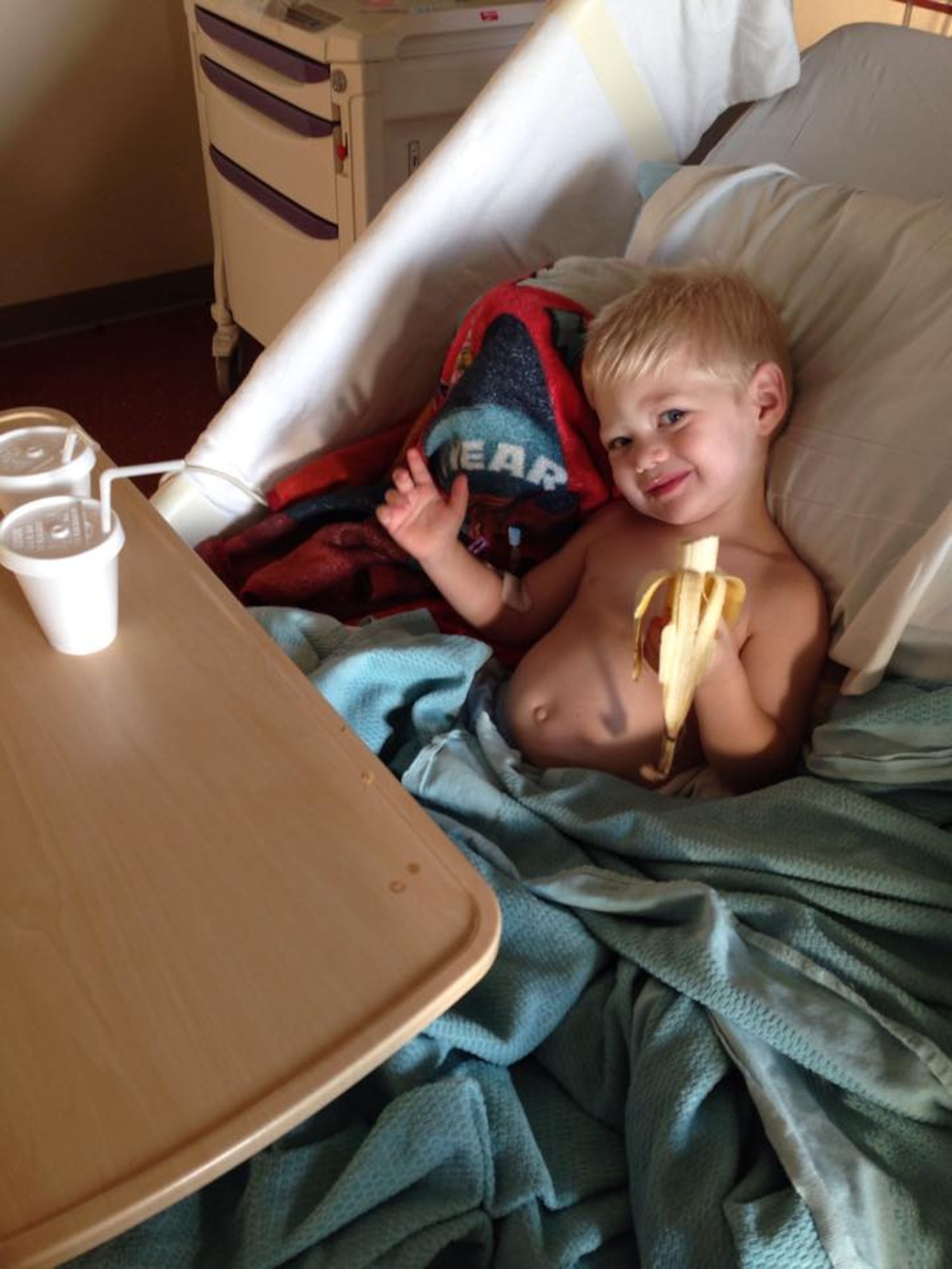 Paul Boyer snacks on a banana in the days following his surgery at Phoenix Children’s Hospital in Phoenix. (Courtesy photo)