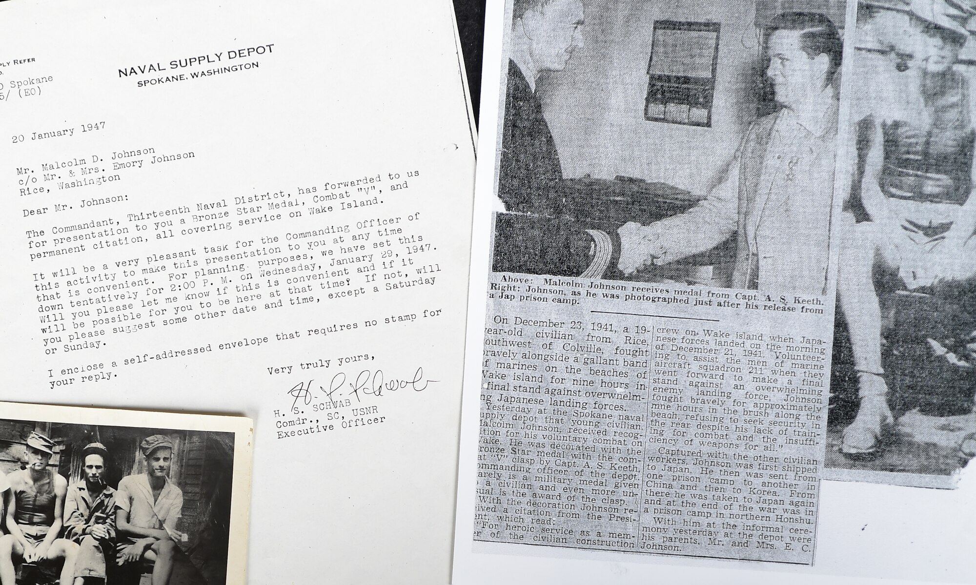 A photo of Malcolm Johnson upon his release from a Japanese internment camp, a notification of being awarded a Bronze Star Medal, and a news article are shown at Davis-Monthan Air Force Base, Ariz., Aug. 26, 2015. Some of Johnson’s memorabilia will be on display at the Pima Air and Space Museum in Tucson, Ariz., Sept. 18, 2015, in observance of POW/MIA day. (U.S. Air Force photo by Airman 1st Class Mya M. Crosby/Released)