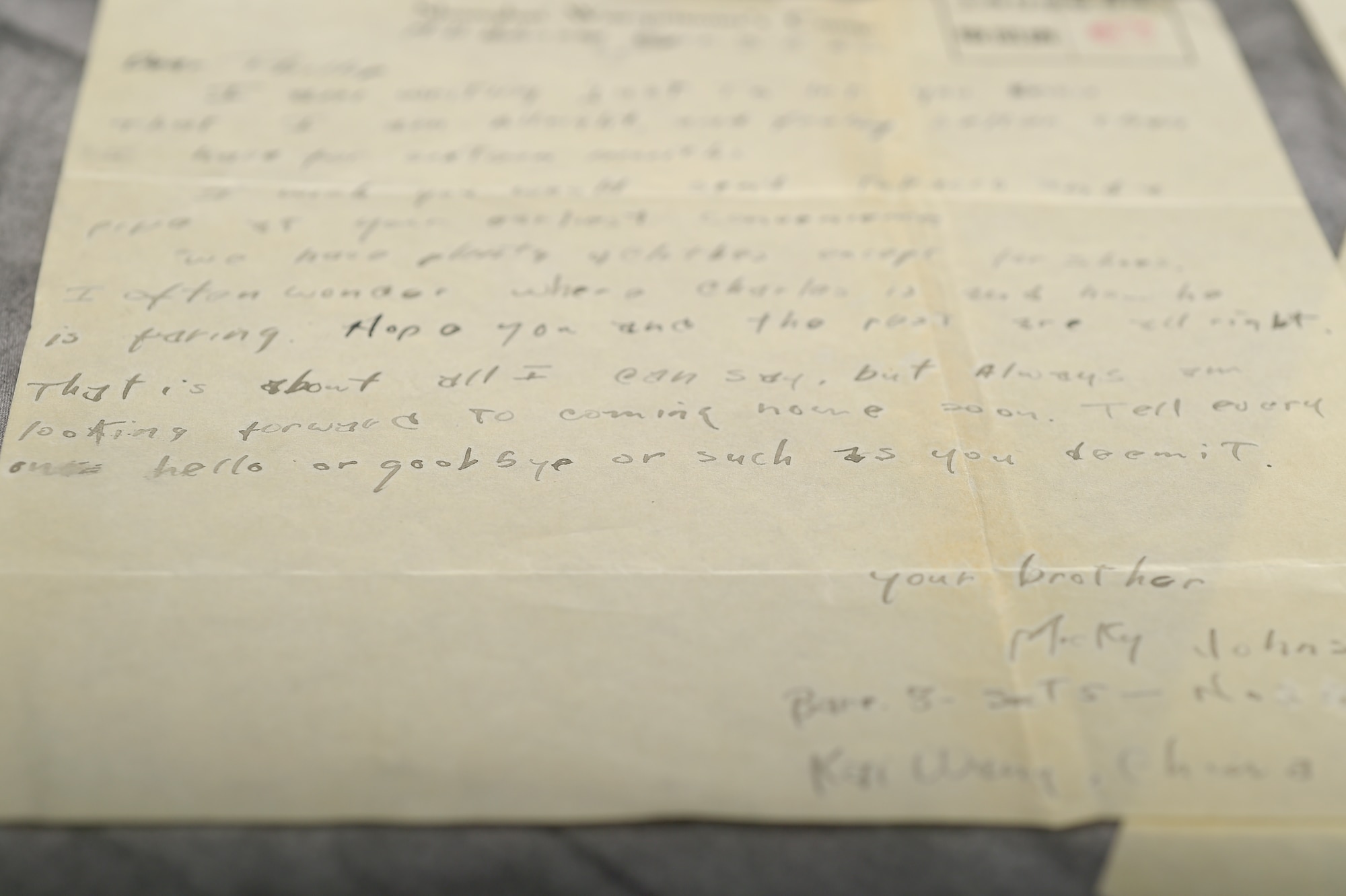 A letter from Malcolm Johnson, World War II veteran and former prisoner of war, written to his brother while Johnson was held in Japanese internment camps lays on a table at Davis-Monthan Air Force Base, Ariz., Aug. 26, 2015. The letters Johnson wrote took a minimum of six months to get to Johnson’s family. (U.S. Air Force photo by Airman 1st Class Mya M. Crosby/Released)