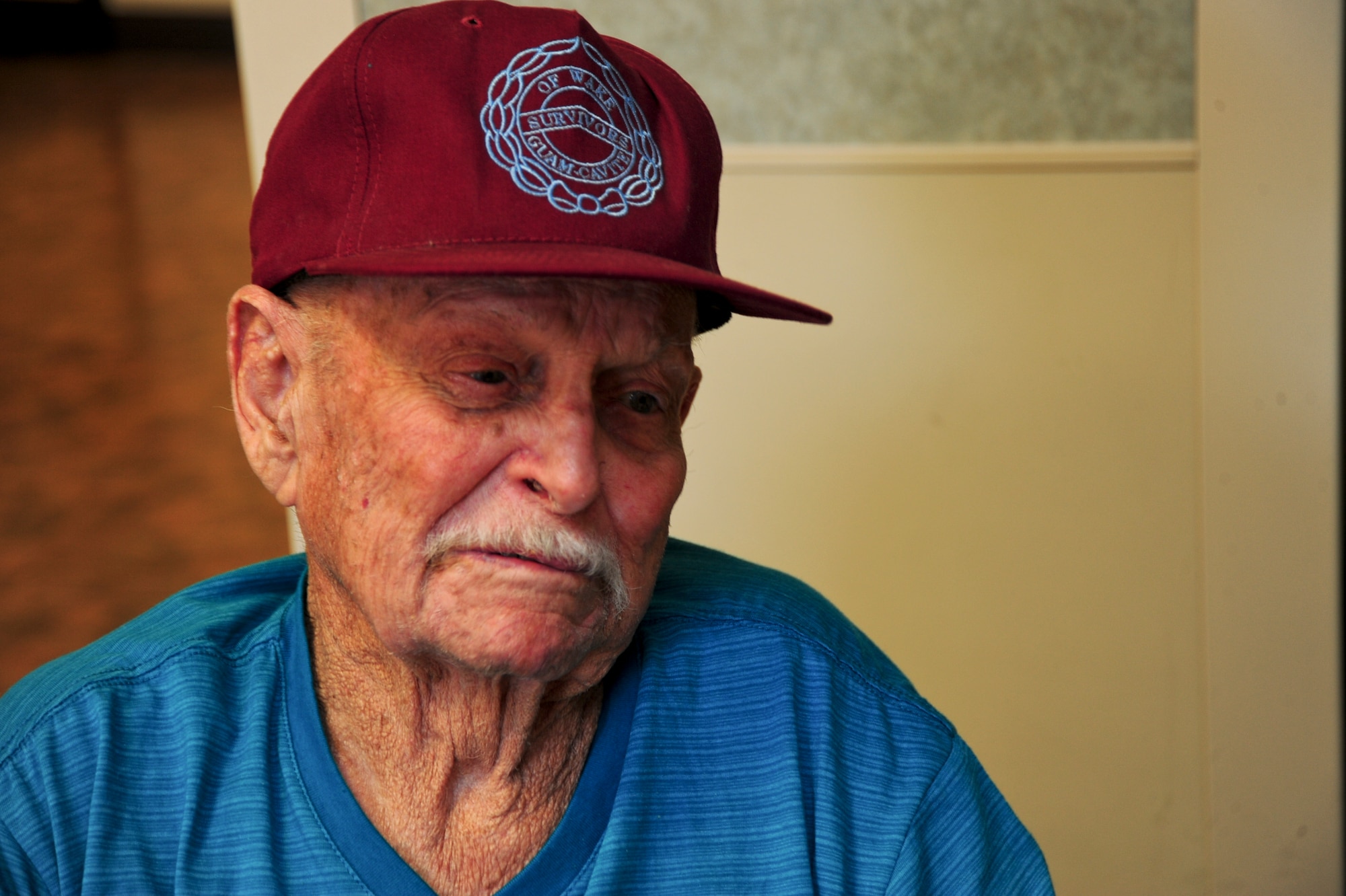 Malcolm Johnson, World War II veteran and former prisoner of war, tells his story at the Tucson Veterans Center in Tucson, Ariz., Aug. 18, 2015. Johnson was a civilian contractor when he was captured in December 1941. Nearly five years after being captured, Johnson was awarded the Bronze Star Medal with Valor in 1947. (U.S. Air Force photo by Senior Airman Chris Massey/Released)