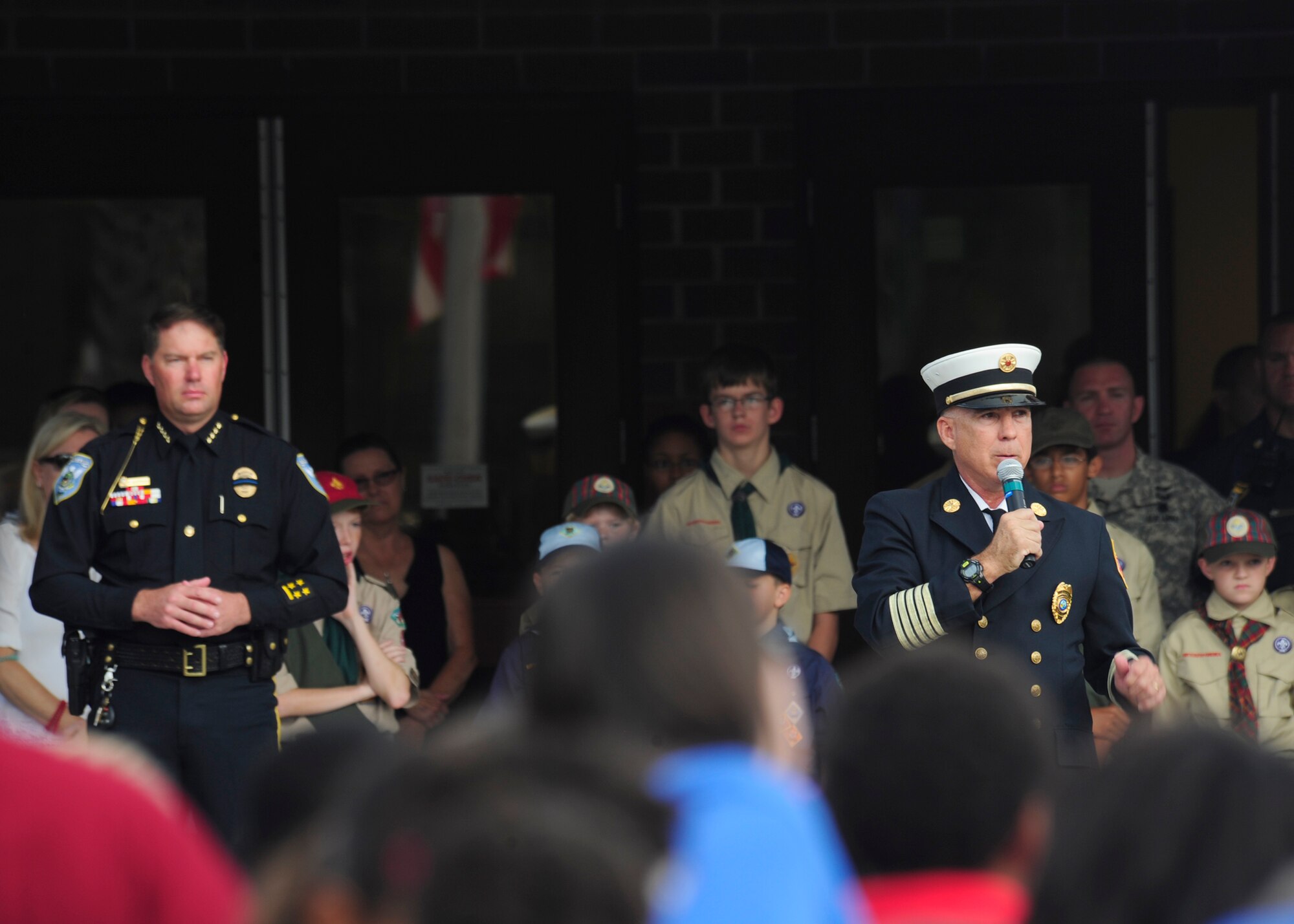 First responders and service members visit Breakfast Point Academy Sept. 11 to attend a flag raising and memorial ceremony and speak to students about the events of 9/11. The terrorist attacks of 9/11 resulted in a large loss of American life.  (U.S. Air Force photo by Airman 1st Class Solomon Cook/Released)