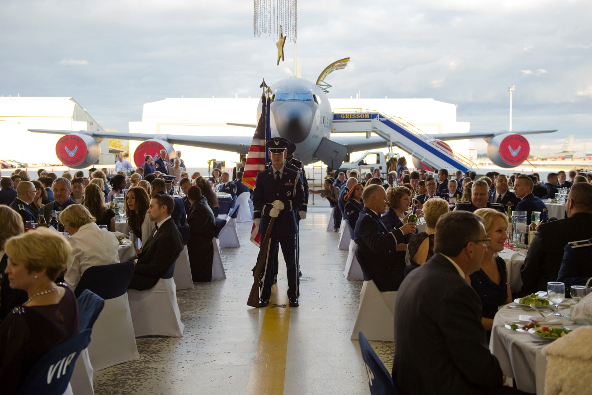 Members of Grissom's honor guard stand in formation prior to a presentation of colors ceremony during an Air Force Ball at Grissom Air Reserve Base, Ind., Sept. 12, 2015.  This year's ball, 'Wings over America: A salute to the 1940s' featured music and festivities from that era inside a hangar transformed with authentic World War II memorabilia.  (U.S. Air Force Photo/Tech. Sgt. Benjamin Mota)