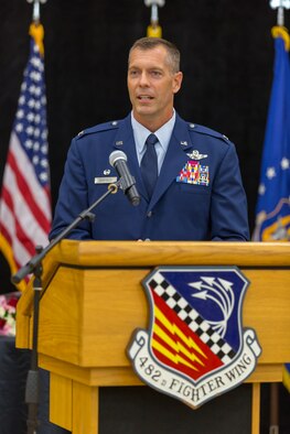 Col. David P. Garfield, the 482nd Fighter Wing commander, addresses members of Team Homestead for the first time as their new commander during a change-of-command ceremony in Building 471, at Homestead Air Reserve Base, Florida, Sept. 13. Col. Garfield assumed command from Brig. Gen. Christian G. Funk, who is leaving for Randolph Air Force Base, Texas. (U.S. Air Force photo by Tech. Sgt. Lionel Castellano)