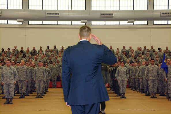 Col. David P. Garfield, the 482nd Fighter Wing commander, renders his first salute to his troops as their new commander during a change-of-command ceremony in Building 471, at Homestead Air Reserve Base, Florida, Sept. 13. Garfield assumed command from Brig. Gen. Christian G. Funk who is leaving for Randolph Air Force Base, Texas. (U.S. Air Force photo by Senior Airman Frank Casciotta)