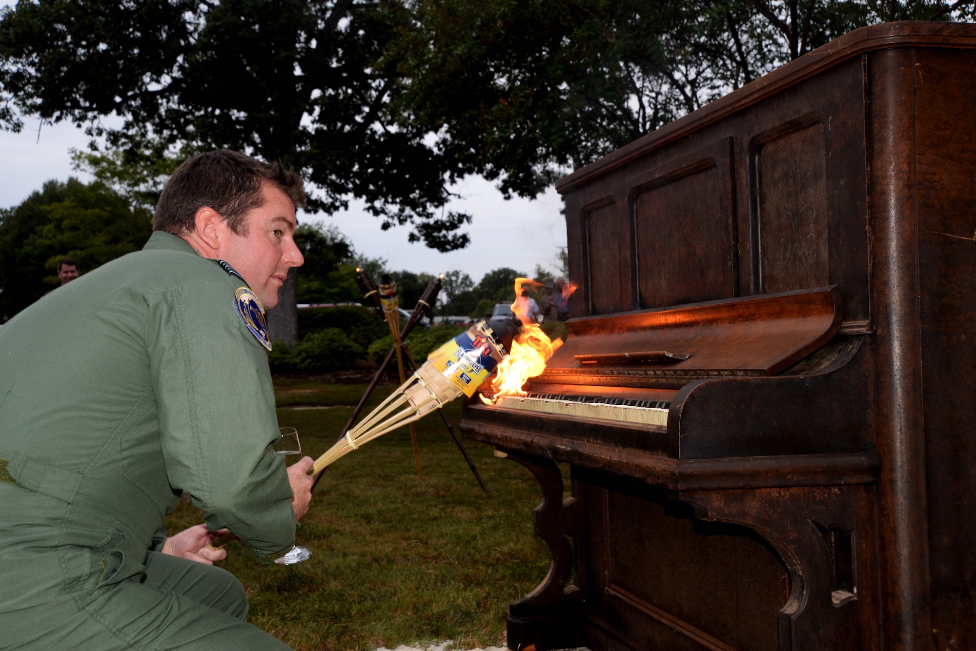 Royal Air Force Lt. Col. James Radley, an Air Command and Staff College student, sets a piano ablaze during the celebration of the 75th anniversary of the Battle of Britain Sept. 11, 2015, at Maxwell Air Force Base, Alabama. American Airmen, international partners and Royal Air Force officers participated in the piano burning to commemorate the Battle of Britain, an air campaign conducted by the German Luftwaffe against the United Kingdom in 1940. The Battle of Britain was the first victory over the Germans and served as a turning point in the war. (U.S. Air Force photo by Airman 1st Class Alexa Culbert/Cleared) 