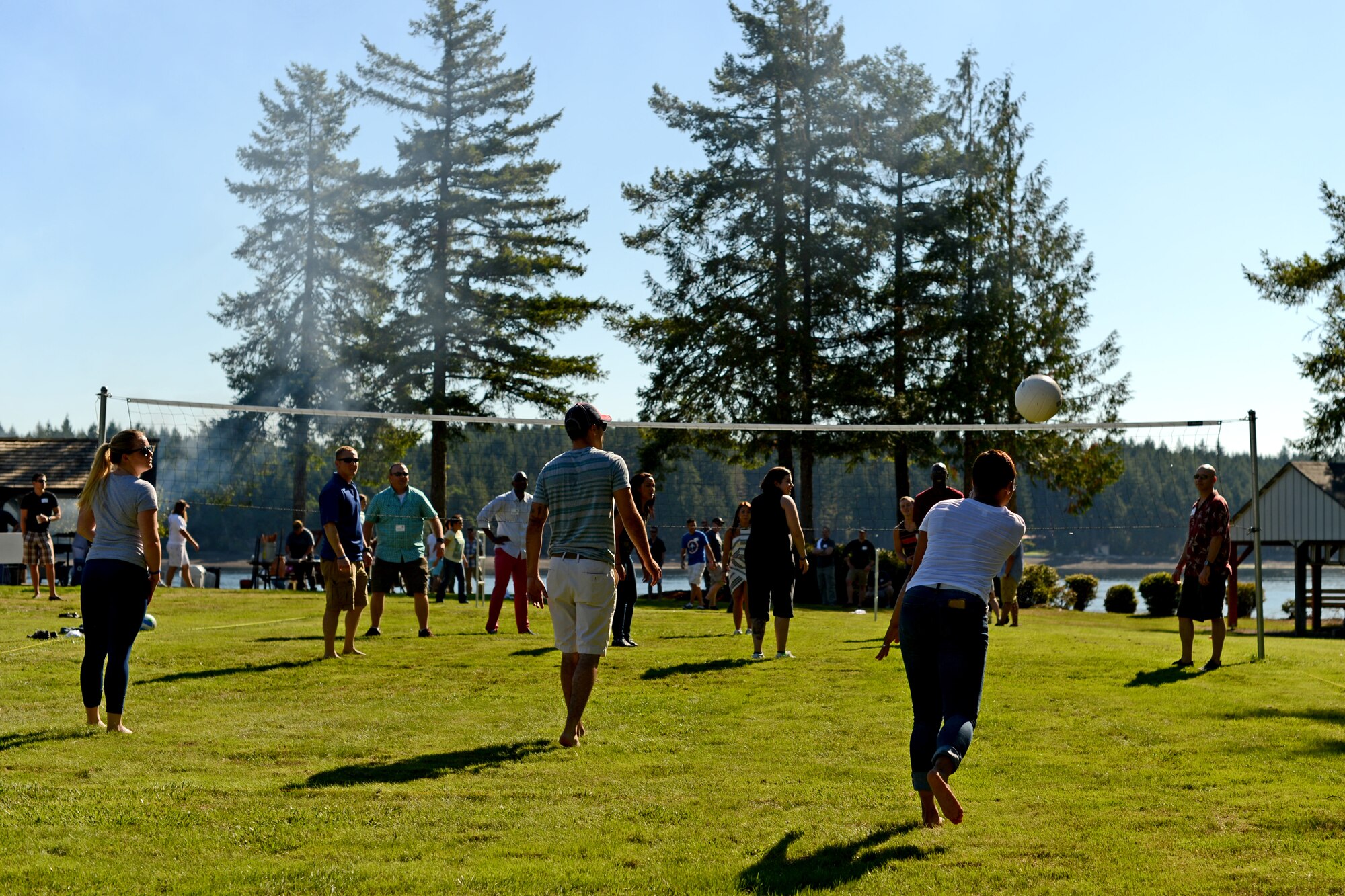 Service members, members of the Olympia Yacht Club and Thurston County Chamber of Commerce play a game of volleyball Sept. 11, 2015, during Foofaraw at the Olympia Yacht Club Island Home, Wash. During the event, attendants played various games such as basketball, horseshoes, and tug of war. (U.S. Air Force photo/Staff Sgt. Tim Chacon)