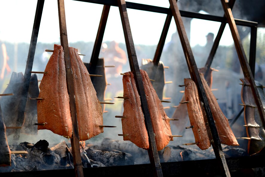 Salmon cooks over a fire Sept. 11, 2015, during Foofaraw at the Olympia Yacht Club Island Home, Wash. The salmon was cooked by members of the Chehalis Indian Tribe. (U.S. Air Force photo/Staff Sgt. Tim Chacon)