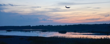 A C-130 Hercules Aircraft from the 757th Airlift Squadron, an Air Force Reserve unit from Youngstown, OH, conducts a dry run for the mosquito aerial spray over Joint Base Charleston - Weapons Station in Charleston, South Carolina, Sept. 11, 2015. Aerial spray flight proficiency training was also accomplished while providing a beneficial reduction in mosquito populations affecting the health and welfare of the people at Joint Base Charleston. (U.S. Air Force photo/Airman 1st Class Thomas T. Charlton)