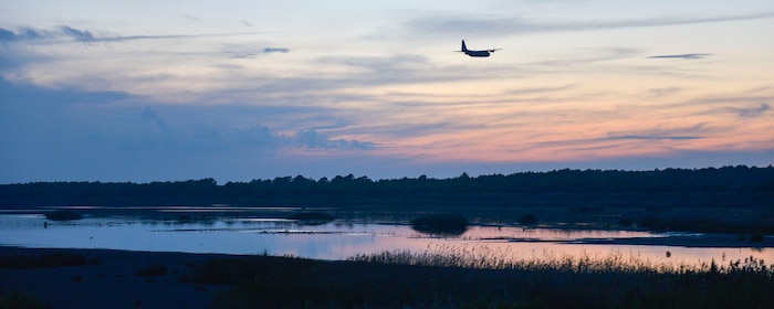 A C-130 Hercules Aircraft from the 757th Airlift Squadron, an Air Force Reserve unit from Youngstown, OH, conducts a dry run for the mosquito aerial spray over Joint Base Charleston - Weapons Station in Charleston, South Carolina, Sept. 11, 2015. Aerial spray flight proficiency training was also accomplished while providing a beneficial reduction in mosquito populations affecting the health and welfare of the people at Joint Base Charleston. (U.S. Air Force photo/Airman 1st Class Thomas T. Charlton)