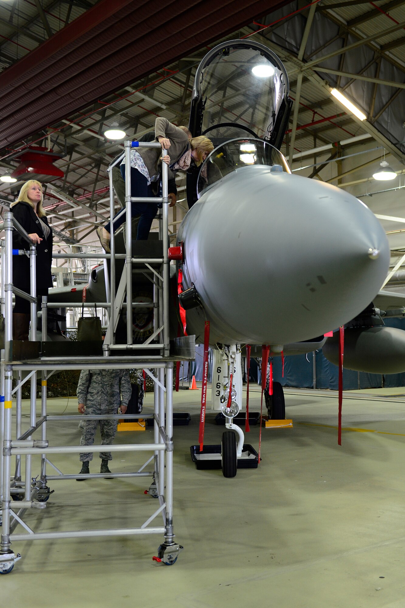 Retirees observe the inside of a 493rd F-15C Eagle at the 29th annual Retiree Appreciation Day at Royal Air Force Lakenheath, England, Sept. 11, 2015. Retiree Appreciation Day provides retirees living in the United Kingdom an opportunity to remain up-to-date with events involving active-duty members, medical and dental amenities, as well as other benefits available on the installation. (U.S. Air Force photo by Airman 1st Class Erin R. Babis/Released)