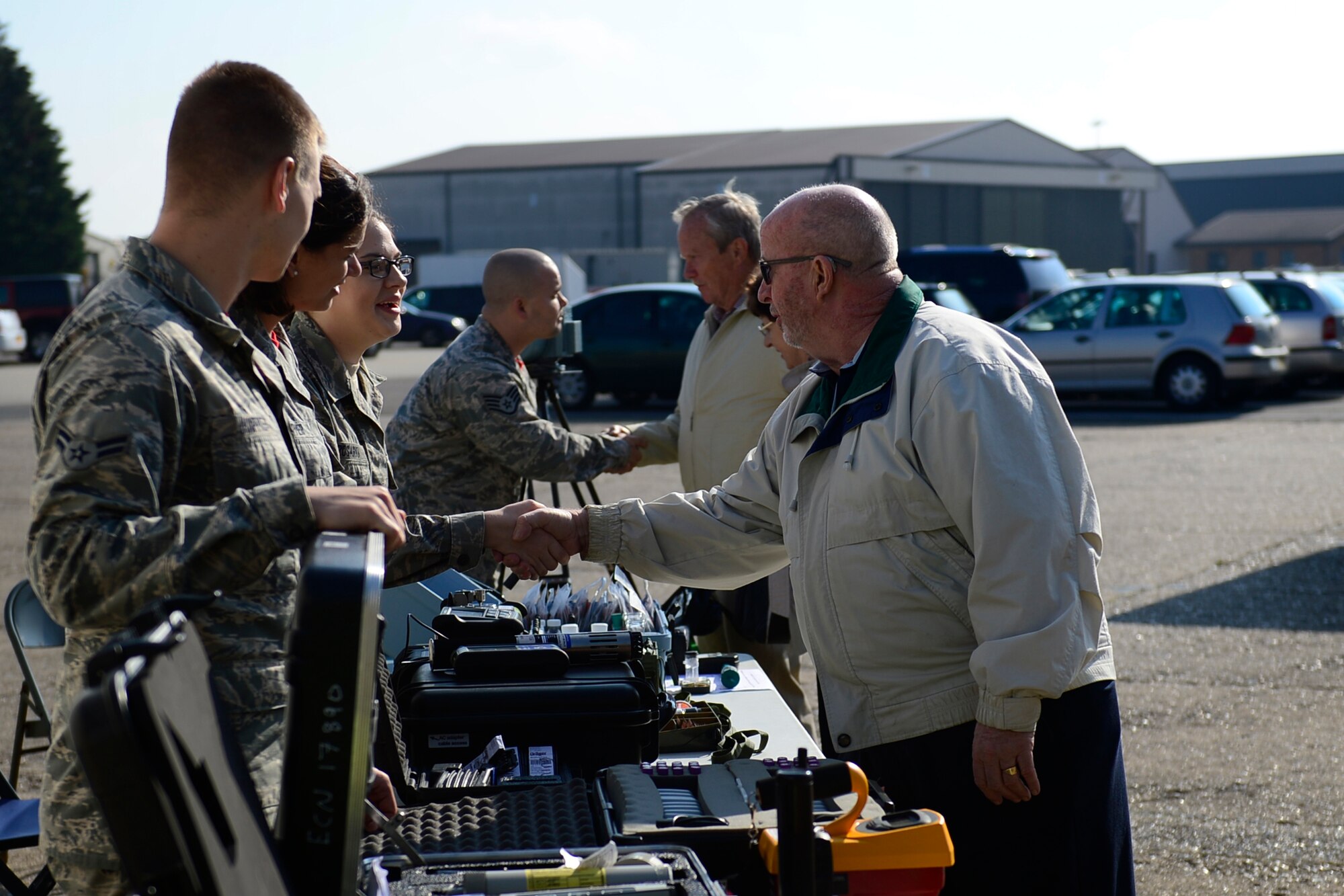 Airmen from the 48th Aerospace Medicine Squadron explain their jobs and equipment to retirees at the 29th annual Retiree Appreciation Day at Royal Air Force Lakenheath, England, Sept. 11, 2015. This event gives active-duty Airmen the opportunity to interact with retirees and pay respects to those who have served before them. (U.S. Air Force photo by Airman 1st Class Erin R. Babis/Released) 