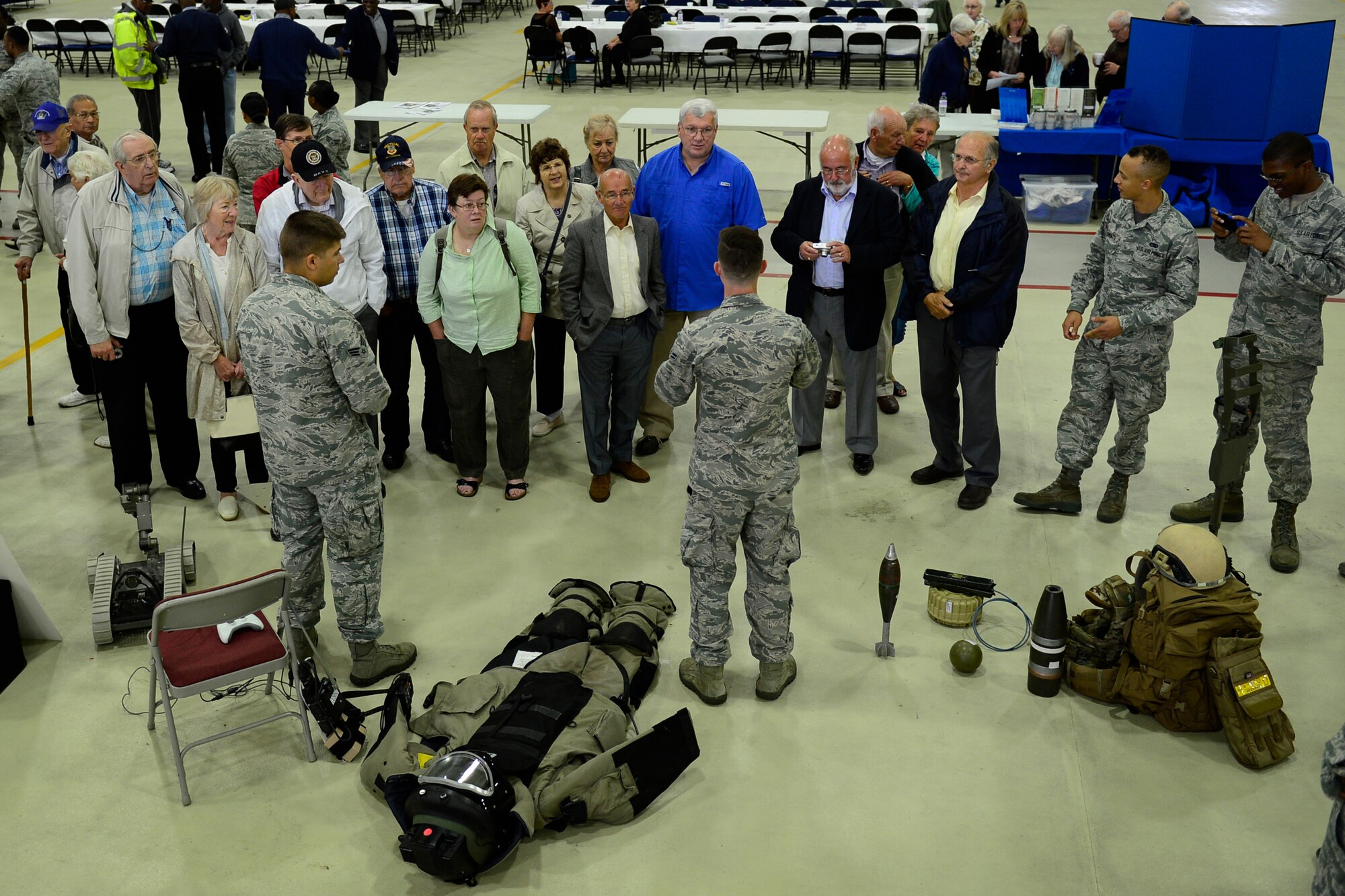 Explosive Ordnance Disposal Airmen from the 48th Civil Engineer Squadron show the advances in their equipment to retirees at the 29th annual Retiree Appreciation Day at Royal Air Force Lakenheath, England, Sept. 11, 2015. Retiree Appreciation Day provides retires living in the United Kingdom an opportunity to remain up-to-date with events involving active-duty members, medical and dental benefits, as well as other benefits available on the installation. (U.S. Air Force photo by Airman 1st Class Erin R. Babis/Released)