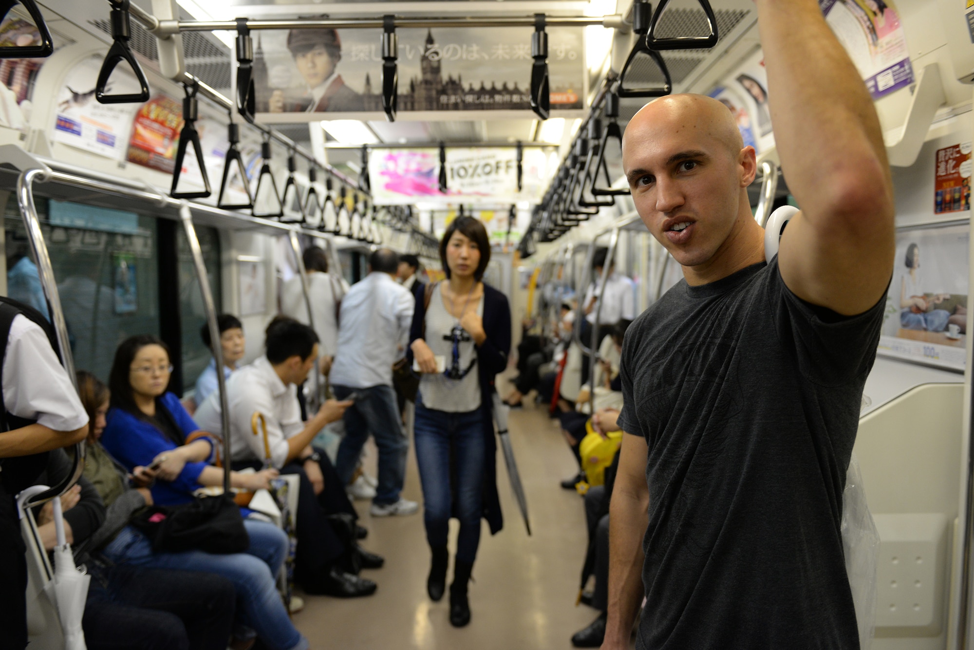 Staff Sgt. Zackary Webb, 374th Civil Engineer Squadron electrical systems craftsman, travels Japan via train in Tokyo, Sep. 9, 2015. Airmen take advantage of the trains for easy access to Tokyo and further regions. (U.S. Air Force photo by Airman 1st Class Elizabeth Baker/Released)
