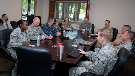 Chaplain (Col.) James Tims, Air Mobility Command chaplain (center), talks with the Air Base chapel staff Sept. 14, 2015, at the Air Base chapel on Joint Base Charleston – Air Base, S.C. Tims was visiting JB Charleston to meet with the Air Base and Weapons Station chaplains and staff to see the mission firsthand. (U.S. Air Force photo/Airman 1st Class Clayton Cupit)