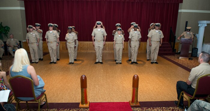 Joint Base Charleston’s newest Chief Petty Officer selects are hatted by their sponsors Sept. 16, 2015, at the Redbank Club on JB Charleston – Weapons Station, S.C. CPO’s serve a dual role as both technical experts and as leaders. The new selects (Left to right) are EMC(SW/AW) Thomas Byers, Navy Operation Support Center, LSC(SW/AW) Christopher Byrd, NOSC, YNC(SW/AW) Ashley Cooper, Navy Consolidated Brig Charleston, HMC Marchae Howard, NOSC, FCC(SW) William McElroy, NAVCONBRIG Charleston, YNC(EXW) Jayna Sampson, NOSC, MNC(SW) David Toyloy, Navy Munitions Command Unit Charleston and DCC(EXW) Paul Wilkins, NOSC. (U.S. Air Force photo/Airman 1st Class Clayton Cupit)