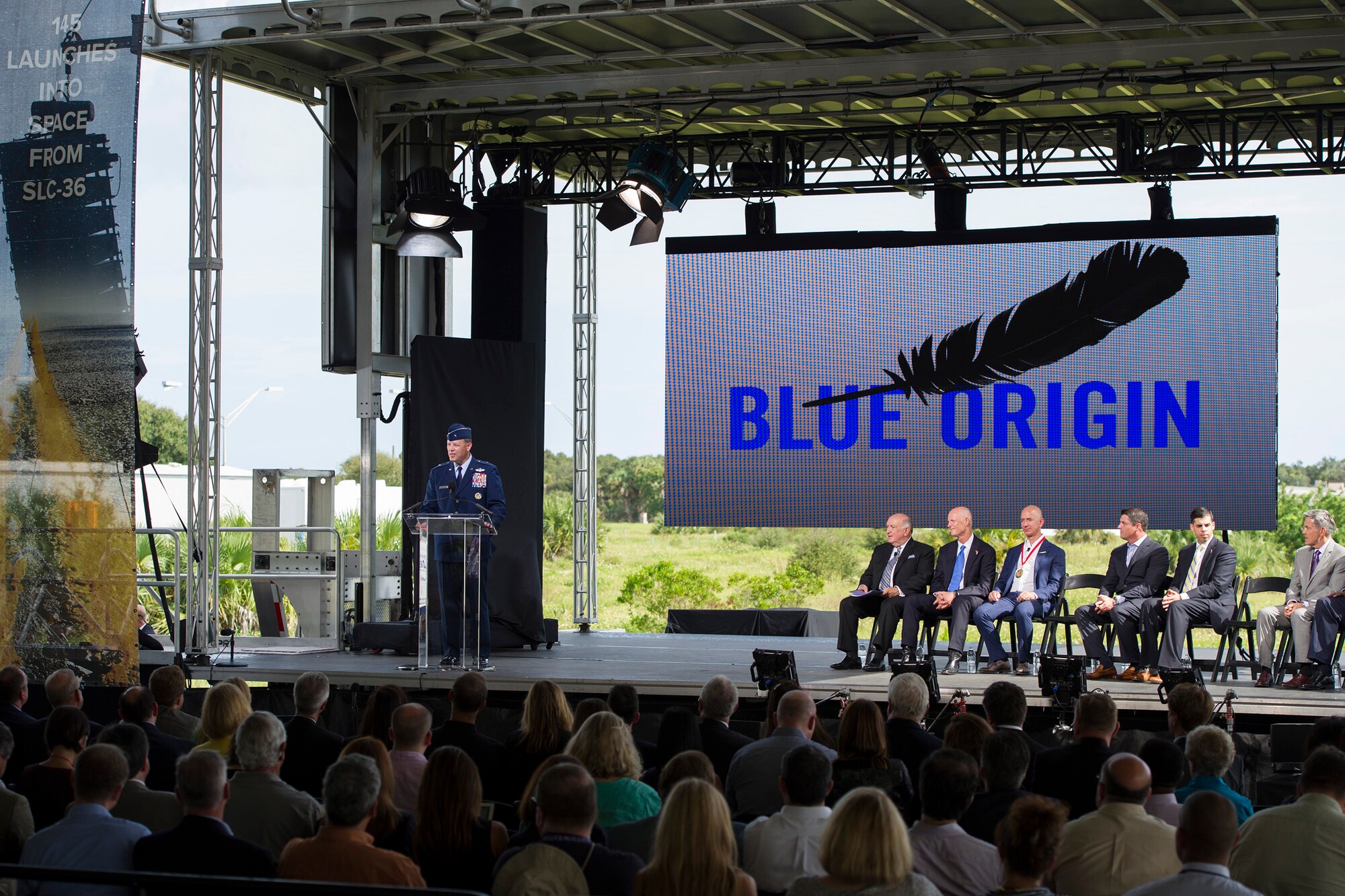 Brig. Gen. Steven Garland, 14th Air Force vice commander, left, provides remarks at a Blue Origin media event held at Space Launch Complex 36 at Cape Canaveral Air Force Station, Florida, Sept 15, 2015. “The 45th Space Wing has worked aggressively to make launch property available to commercial space launch activities and to date has leased or licensed 65 Cape Canaveral Air Force Station facilities totaling more than 800,000 square feet at a value of more than $890 million,” Garland said. (U.S. Air Force photo by Matthew Jurgens/Released) 