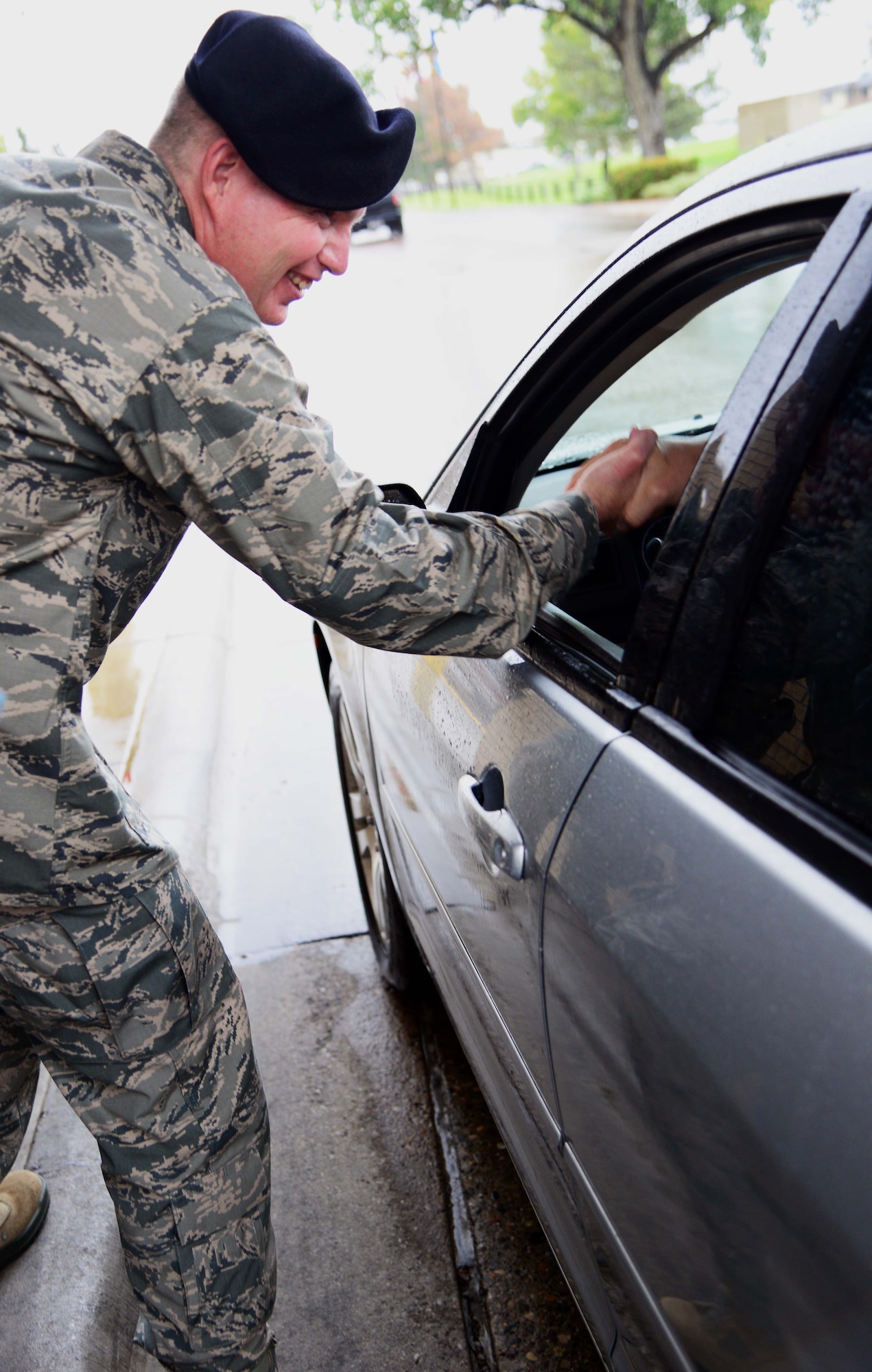 Col. Robert Frederiksen, 341st Security Forces Group commander, shakes the hand of an old friend at the base’s main gate Sept. 16, 2015, at Malmstrom Air Force Base, Mont. Frederiksen has recently returned to Malmstrom AFB after more than 20 years to take command of the 341st SFG.  (U.S. Air Force photo/Airman 1st Class Magen M. Reeves)