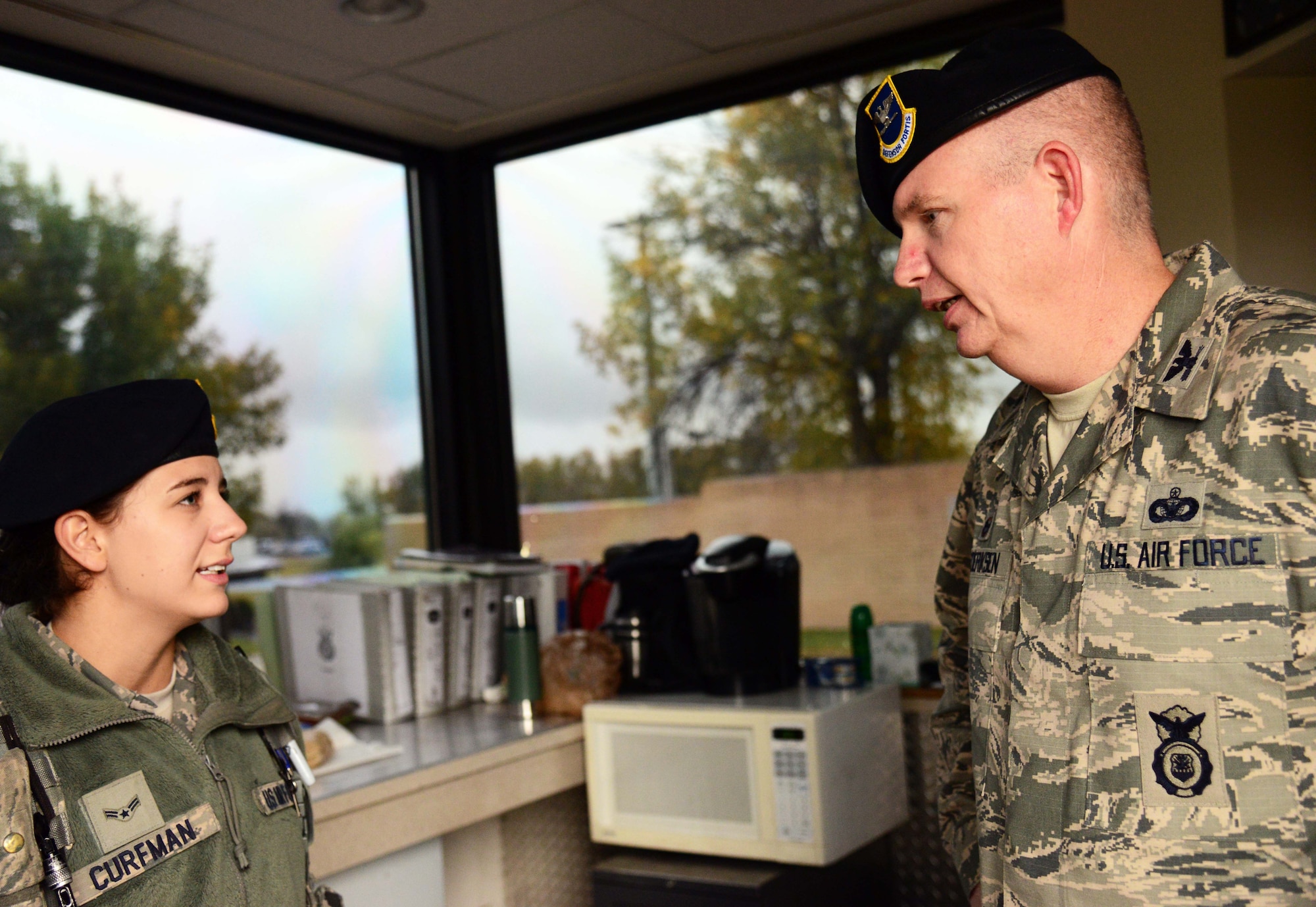 Airman 1st Class Heidi Curfman, 341st Security Forces Squadron defender, left, and Col. Robert Frederiksen, 341st Security Forces Group commander, discuss the importance of maintaining security of nuclear assets Sept. 16, 2015, at Malmstrom Air Force Base, Mont. According to Frederiksen, Airmen are the base’s first line of defense between our adversaries and our nuclear assets. (U.S. Air Force photo/Airman 1st Class Magen M. Reeves)