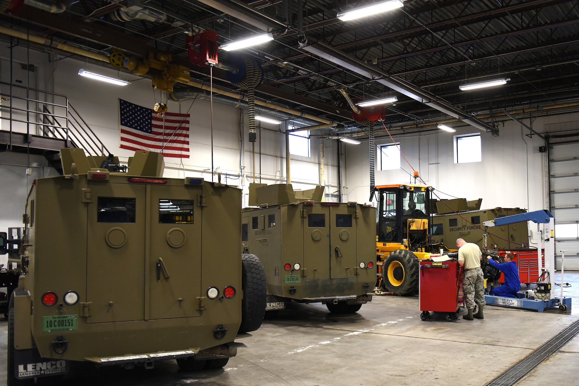 Airmen from the 341st Logistics Readiness Squadron vehicle maintenance heavy equipment shop, work on large Bearcat vehicles used for safe travel to and from Malmstrom Air Force Base, Mont., Sept. 14, 2015. An average of 14 personnel at the heavy equipment shop upkeep these vehicles year-round, sometimes pulling 12-hour shifts for 24-hours. (U.S. Air Force photo/Chris Willis)