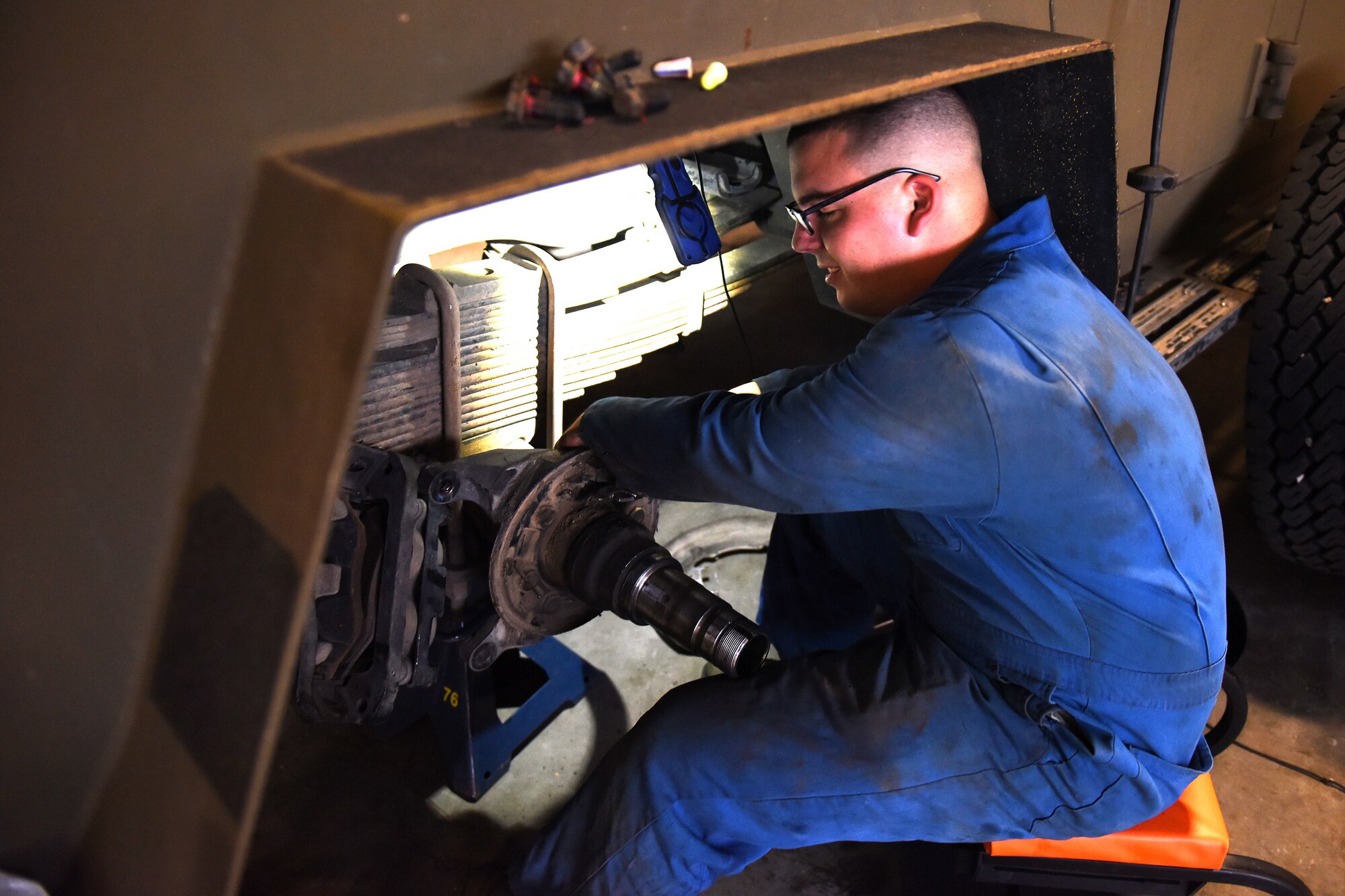 Airman 1st Class Darrick Banks, 341st Logistics Readiness Squadron vehicle maintenance technician, installs rear brake calibers and pads Sept. 15, 2015, at Malmstrom Air Force Base, Mont. In the month of August, the base’s Humvee and Bearcat armored vehicles, which are large and built to withstand enemy attack, spent more than 19,500 hours on the road. (U.S. Air Force photo/Chris Willis)