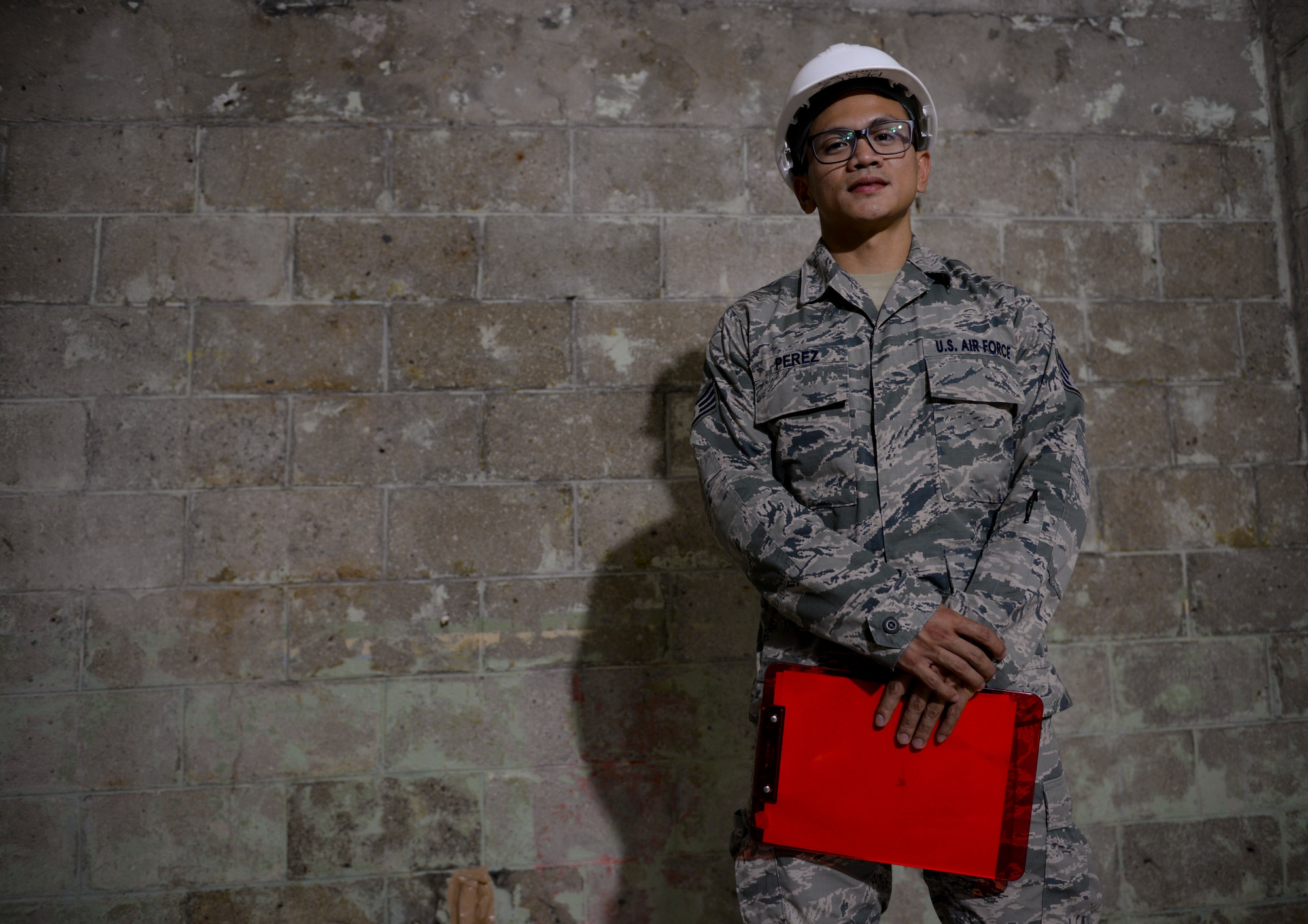U.S. Air Force Staff Sgt. Jomar Perez, 718th Civil Engineer Squadron construction management inspector, grew up in the Philippines and overcame many cultural adversities as he transitioned to an Air Force career. He was recognized by Brig. Gen. Barry Cornish, 18th Wing commander, with the Shogun Spotlight Award for his outstanding work performance. Photo taken Sept. 11, 2015, on Kadena Air Base, Japan. (U.S. Air Force photo by Senior Airman John Linzmeier)