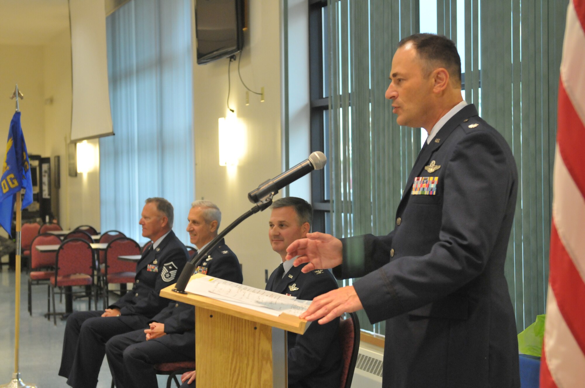 Lt. Col. Chris Sander speaks to the audience after he assumed command of the 109th Operations Group from outgoing commander Col. Michael Steindl during a change of command ceremony at Stratton Air National Guard Base, New York, on Sept. 13, 2015. Sander was previously the 109th Maintenance Group deputy commander. (U.S. Air National Guard photo by Master Sgt. William Gizara/Released)