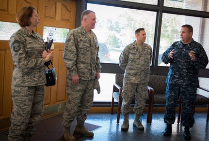 (Left to right) Chief Master Sgt. Tiffany Smith, Air Mobility Command command chaplain assistant functional manager, Chaplain (Col.) James Tims, AMC chaplain and Chaplain (Lt. Col.) Daniel Thompson, joint base senior chaplain talk with Chaplain (LCDR) Russell Hale, Naval Weapons Station chaplain Sept. 15, 2015, at the All Saints Chapel on Joint Base Charleston – Weapons Station, S.C. Tims and Smith were visiting JB Charleston to meet with the Air Base and Weapons Station chaplains and staff to see the mission firsthand. (U.S. Air Force photo/Airman 1st Class Clayton Cupit)