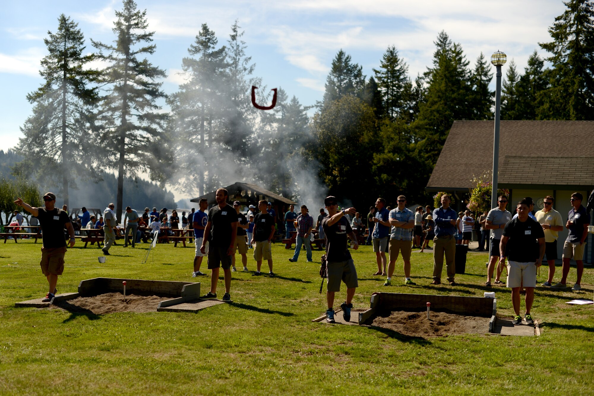 Service members, members of the Olympia Yacht Club and the Thurston County Chamber of Commerce throw horseshoes Sept. 11, 2015, during Foofaraw at the Olympia Yacht Club Island Home, Wash. This year more than 225 service members from all military branches attended Foofaraw, a military appreciation event held by the Olympia Yacht Club and the Thurston County Chamber of Commerce. (U.S. Air Force photo/Staff Sgt. Tim Chacon)