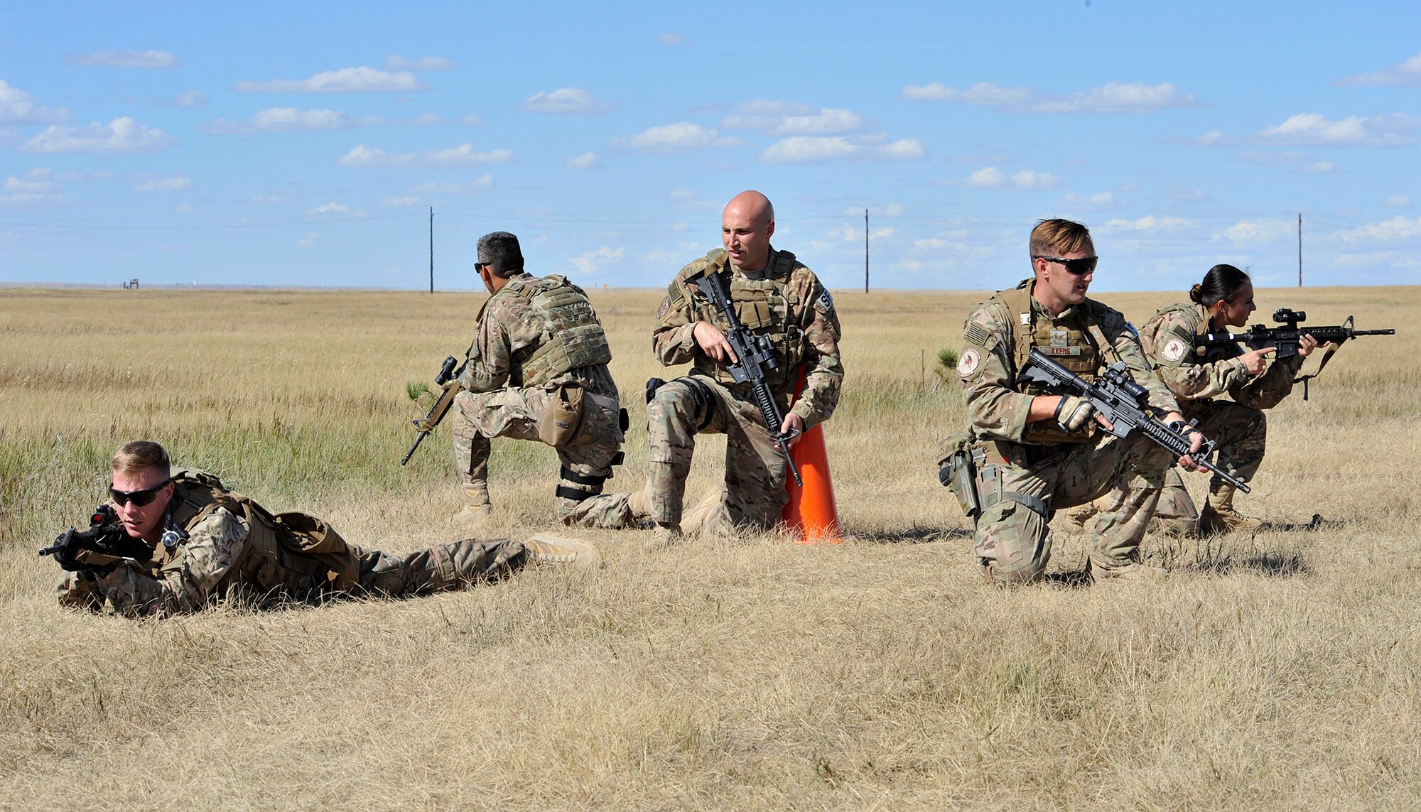 The 341st Missile Wing’s Global Strike Challenge 2015 Security Forces team practices small unit tactics Sept. 10, 2015, at Malmstrom Air Force Base, Mont. Shown from left to right are Senior Airman William Lamb, team member; Senior Airman Tyler Arevalo, team member; Tech. Sgt. Anthony Richards, team leader; Staff Sgt. Bradley Akers, team member; and Airman 1st Class Jessica Ortiz-Villa, team member. The team will compete in Air Force Global Strike Command’s Security Forces competition at Camp Guernsey, Wyo., Sept. 21-25. (U.S. Air Force photo/John Turner)