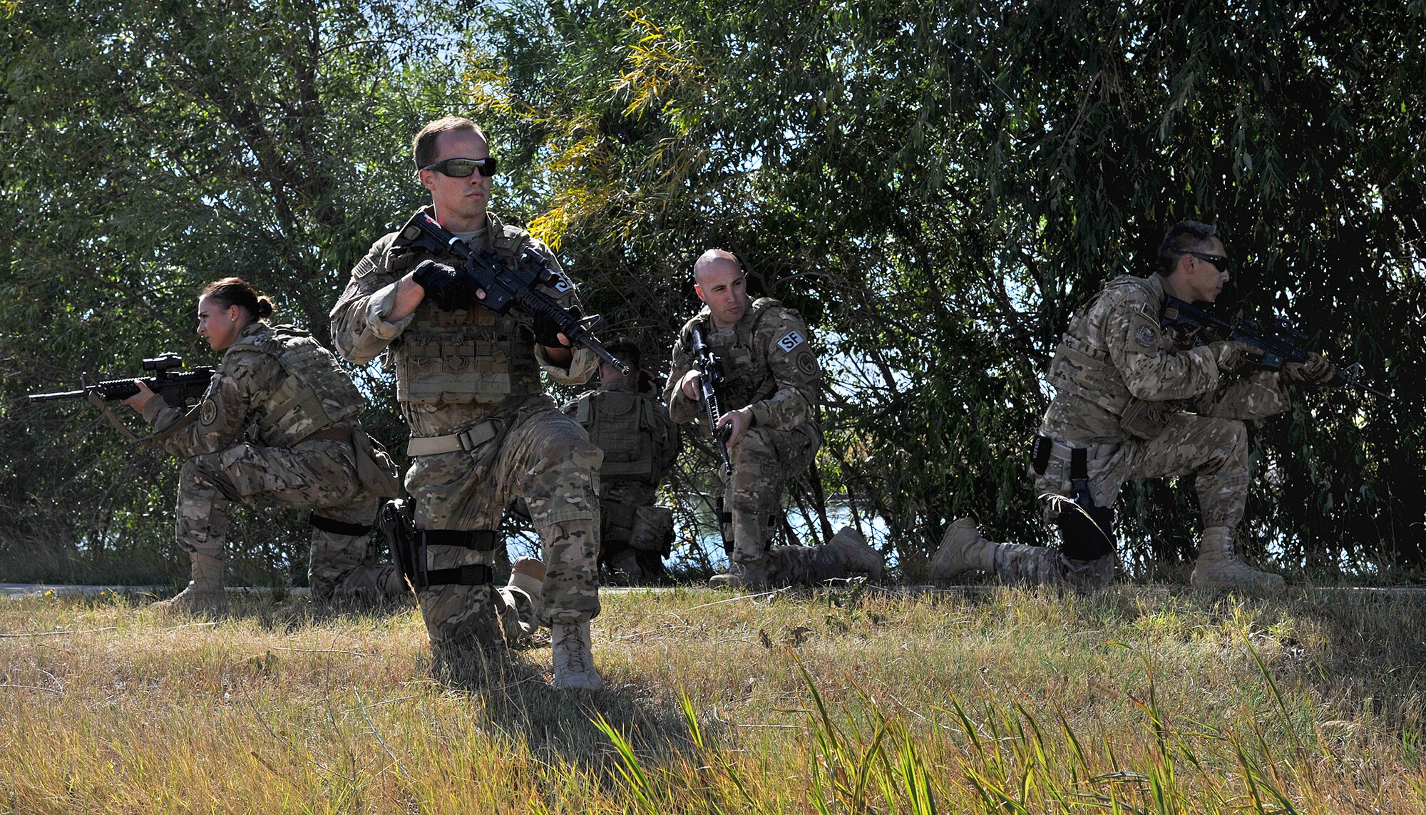 The 341st Missile Wing’s Global Strike Challenge 2015 Security Forces team practices small unit tactics Sept. 10, 2015, at Malmstrom Air Force Base, Mont. Shown from left to right are Airman 1st Class Jessica Ortiz-Villa, team member; 1st Lt. Jonathan Jopling, team member; Staff Sgt. Bradley Akers, team member; Tech. Sgt. Anthony Richards, team leader; and Senior Airman Tyler Arevalo, team member. The team will compete in Air Force Global Strike Command’s Security Forces competition at Camp Guernsey, Wyo., Sept. 21-25. (U.S. Air Force photo/John Turner)
