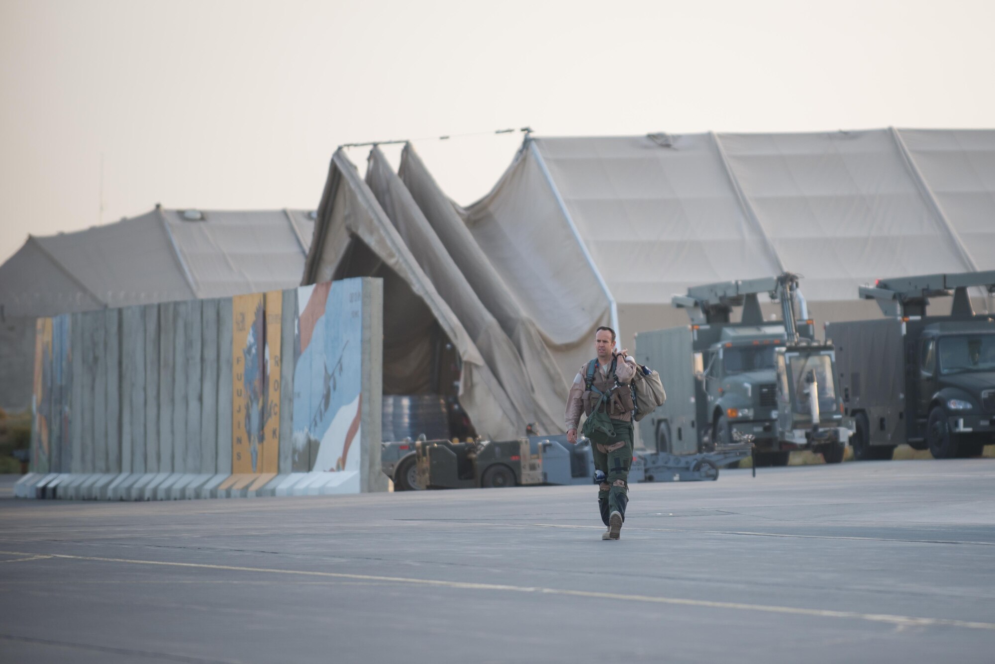 A U.S. Air Force F-16 Fighting Falcon pilot assigned to the 555th Expeditionary Fighter walks to an F-16 before a combat sortie from Bagram Airfield, Afghanistan, Sept. 15, 2015. The F-16 is a multi-role fighter aircraft that is highly maneuverable and has proven itself in air-to-air and air-to-ground combat. (U.S. Air Force photo by Tech. Sgt. Joseph Swafford/Released)
