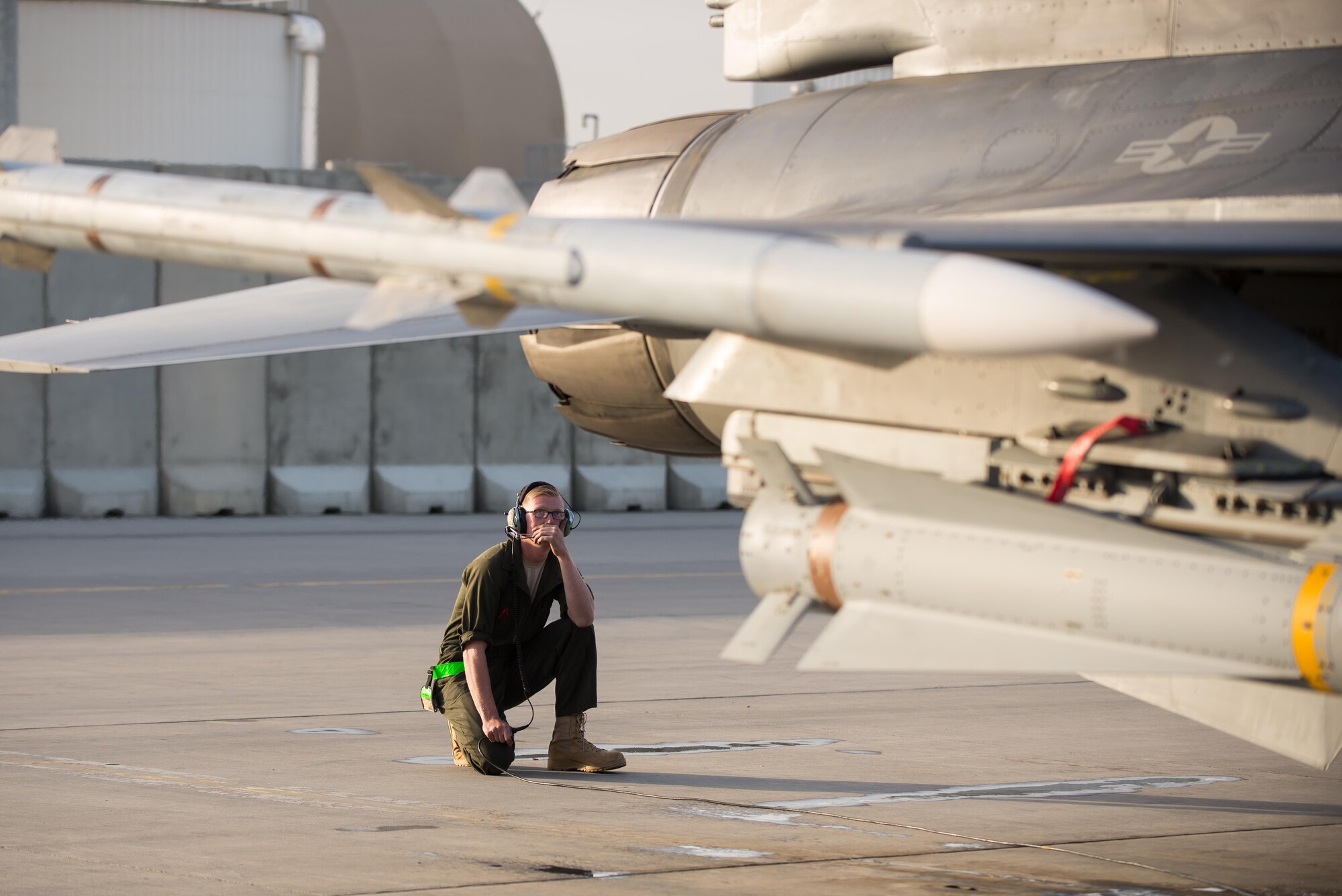 U.S. Air Force Airman 1st Class Dexter Fitzpatrick, 455th Expeditionary Aircraft Maintenance Squadron preforms a preflight inspection on an F-16 Fighting Falcon aircraft before a combat sortie from Bagram Airfield, Afghanistan, Sept. 15, 2015. The F-16 is a multi-role fighter aircraft that is highly maneuverable and has proven itself in air-to-air and air-to-ground combat. (U.S. Air Force photo by Tech. Sgt. Joseph Swafford/Released)