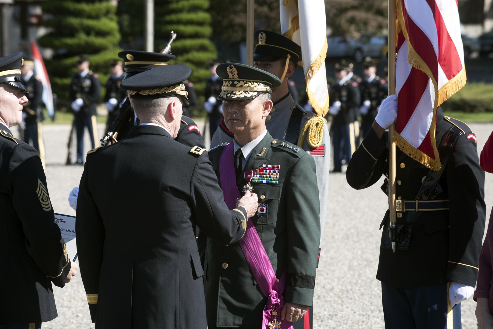 YONGSAN GARRISON, Republic of Korea -- Gen. Park Sun-Woo, out-going CFC deputy commander receives the Legion of Merit from Lt. Gen. Bernard Champoux, Chief of Staff United Nations Command, Combined Forces Command, United States Forces Korea and commander Eighth United States Army during a change of responsibility ceremony on Knight Field Sept. 17. (U.S. Army photo by Staff Sgt. George Gutierrez)