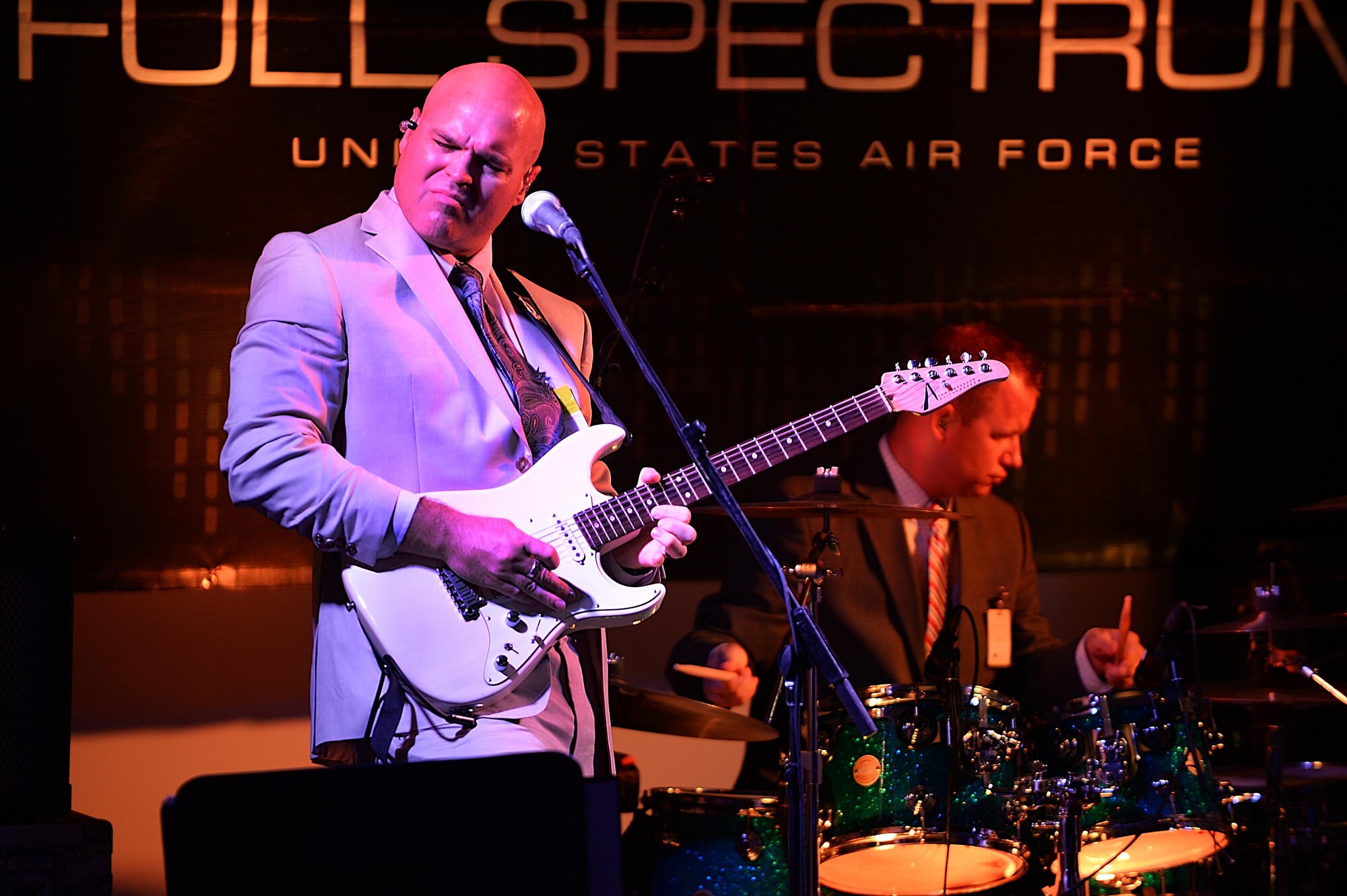 Tech. Sgt. Jason Cale, Air Forces Central Command band guitarist, performs during a concert for students at the Qatar Academy, Doha, Qatar, Sept. 14, 2015. The AFCENT band is composed of musicians who perform and tour throughout the Central Command Area of Responsibility to encourage troop morale, diplomacy and outreach to host nation communities. (U.S. Air Force photo by Staff Sgt. Emerson Nuñez/Released)
