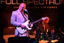 Tech. Sgt. Jason Cale, Air Forces Central Command band guitarist, performs during a concert for students at the Qatar Academy, Doha, Qatar, Sept. 14, 2015. The AFCENT band is composed of musicians who perform and tour throughout the Central Command Area of Responsibility to encourage troop morale, diplomacy and outreach to host nation communities. (U.S. Air Force photo by Staff Sgt. Emerson Nuñez/Released)
