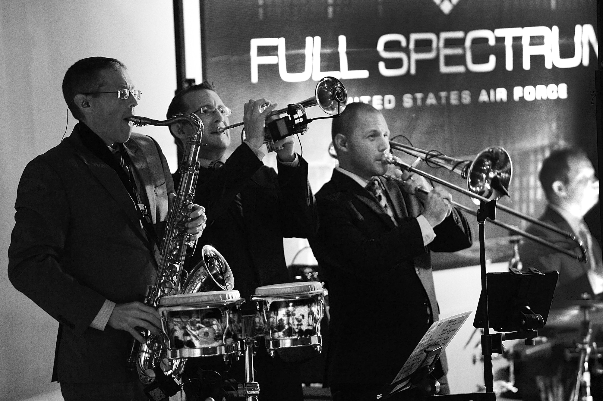 The Air Forces Central Command band horn section, perform during a concert for students at the Qatar Academy, Doha, Qatar, Sept. 14, 2015. The AFCENT band is deployed to Al Udeid Air Base, Qatar, and conducts tours around the Central Command Area of Responsibility as frequently as possible. (U.S. Air Force photo by Staff Sgt. Emerson Nuñez/Released)
