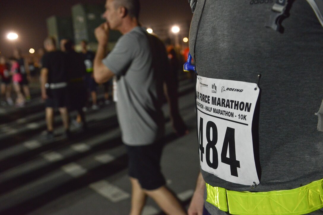 Deployed members make their way to the starting line during the 2015 Air Force Marathon Forward September 13, 2015 at Al Udeid Air Base, Qatar. This will mark seven years that the race has taken place at seven operating bases in theater. The first Air Force Marathon was held in 1997 at Wright-Patterson Air Force Base, Ohio. Since then, each marathon has been held the third Saturday of September, with an aircraft chosen each year to represent Air Force history in flight. (U.S. Air Force photo/ Staff Sgt. Alexandre Montes) 