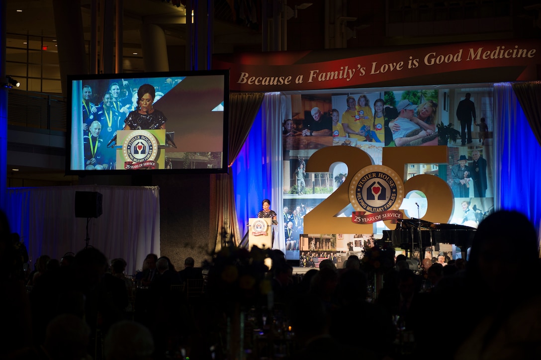 Kyra Phillips, a CNN anchor and the mistress of ceremonies, introduces Defense Secretary Ash Carter as a guest speaker during the Fisher House's 25th Anniversary Gala at the Ronald Reagan Building and International Trade Center in Washington, D.C., Sept. 16, 2015. DoD photo by U.S. Air Force Senior Master Sgt. Adrian Cadiz