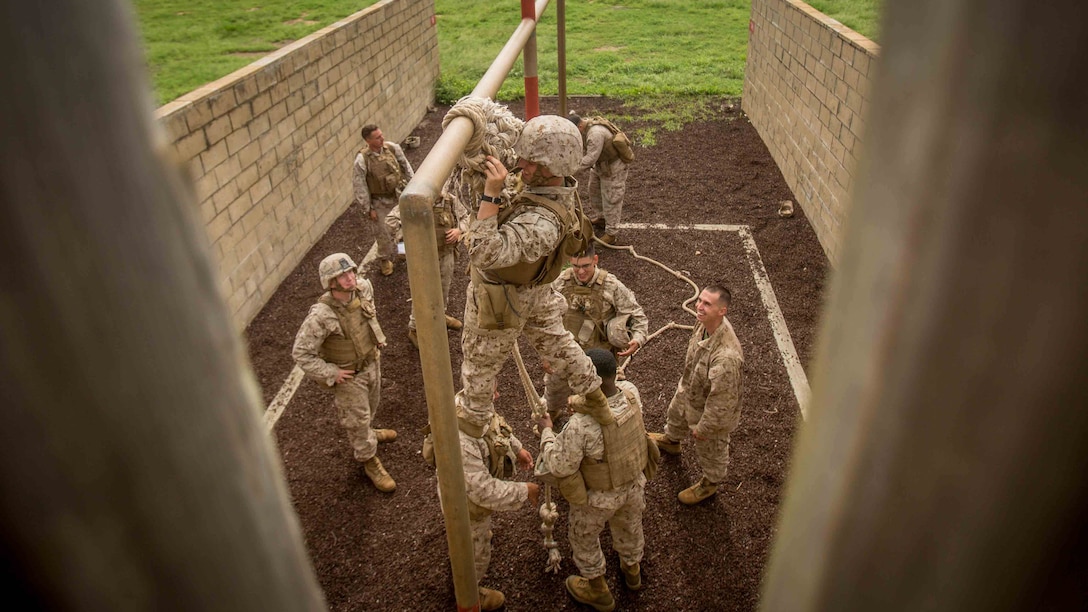 Marines with Bravo Company, 1st Battalion, 3rd Marine Regiment work together to complete an obstacle in the Leadership Reaction Course at Training Area Boondocker aboard Marine Corps Base Hawaii, Sept. 15, 2015. The LRC empowers small unit leaders by putting teams in difficult situations that must be accomplished through teamwork. Bravo Company was conducting sustainment training to ensure they keep their combat mindset sharp and intact before embarking on their upcoming Unit Deployment Program. Training like this supports the mission of Marine Corps Base Hawaii by enhancing and sustaining combat readiness. 