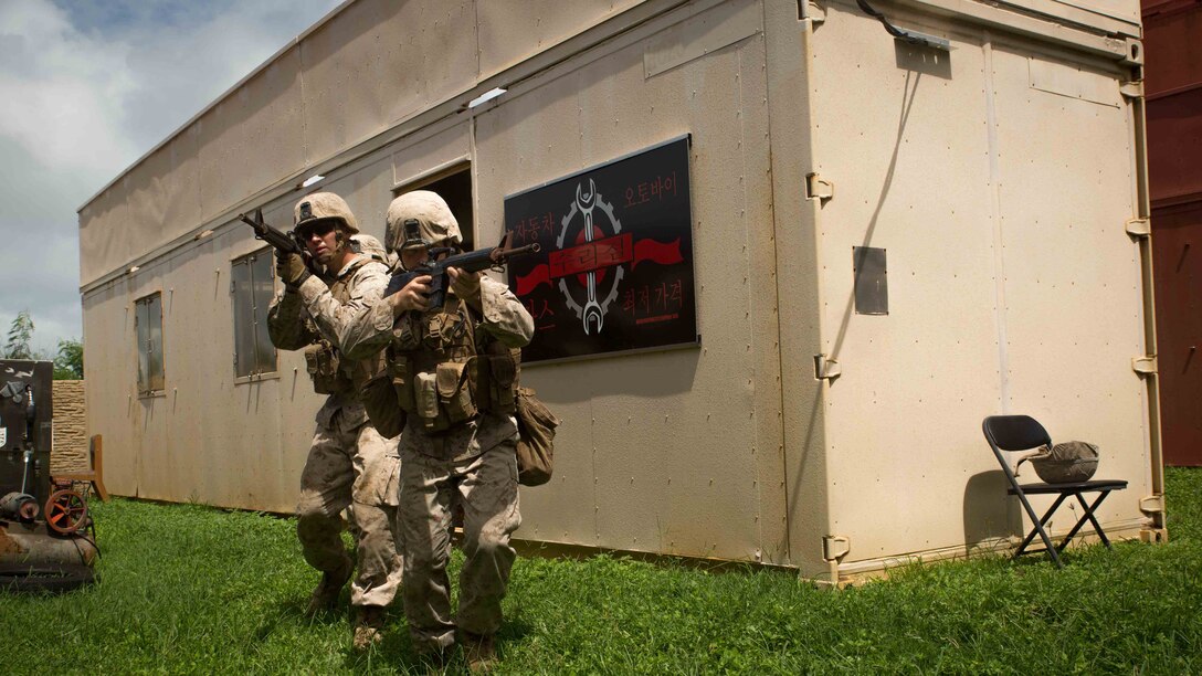 Marines with Bravo Company, 1st Battalion, 3rd Marine Regiment move in a fire team while conducting military operations in urban terrain training at Training Area Boondocker aboard Marine Corps Base Hawaii, Sept. 15, 2015. Bravo Company was conducting sustainment training to ensure they keep their combat mindset sharp and intact before embarking on their upcoming Unit Deployment Program. Training like this supports the mission of Marine Corps Base Hawaii by enhancing and sustaining combat readiness.