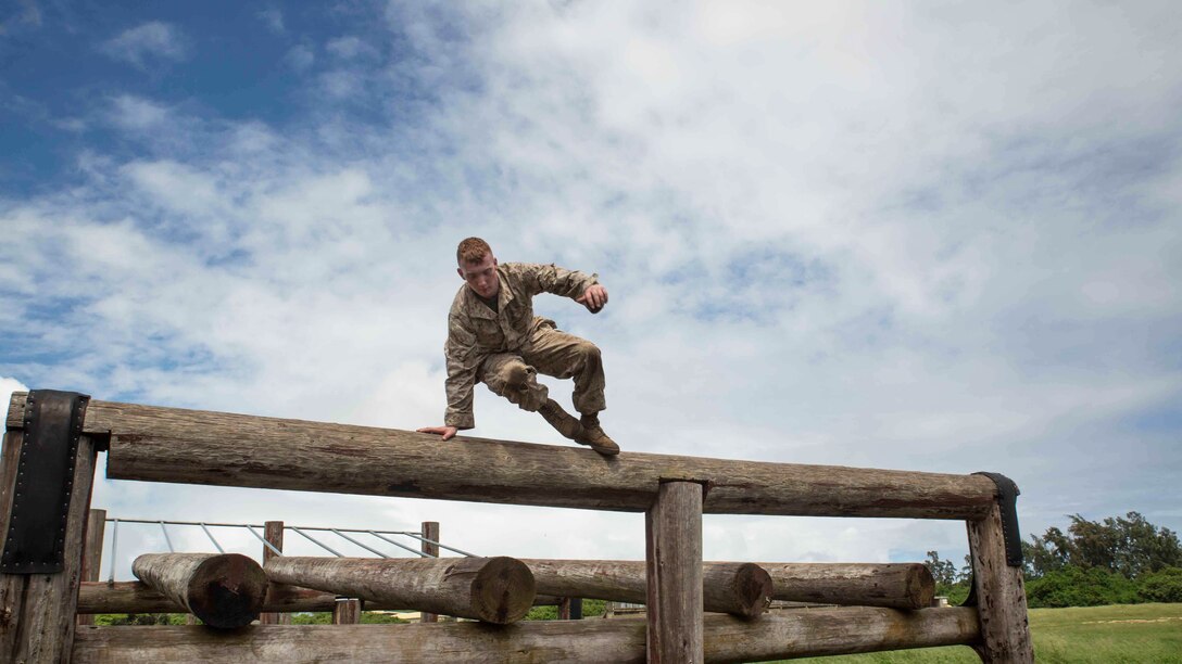 Pfc. Carlton Fyfee, a rifleman with Bravo Company, 1st Battalion, 3rd Marine Regiment and Kilgore, Texas native, hops over a log while running through the obstacle course at Boondocker Training Area aboard Marine Corps Base Hawaii, Sept. 15, 2015. Marines from Bravo Co. 1st Bn., 3rd Marines conducted sustainment training to ensure they keep their combat mindset sharp and intact before embarking on their upcoming Unit Deployment Program. Training like this supports the mission of Marine Corps Base Hawaii by enhancing and sustaining combat readiness. 