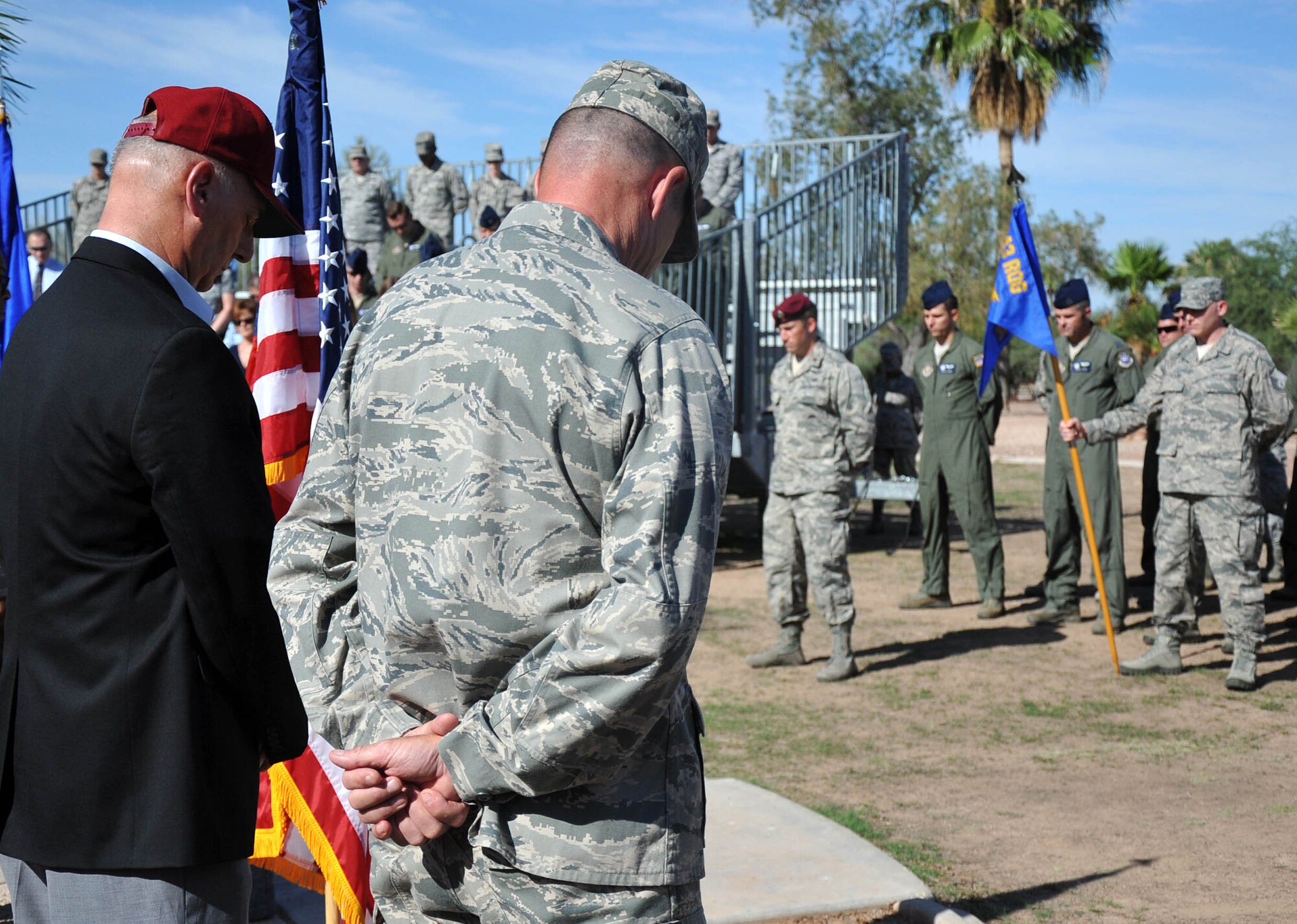 943rd Rescue Group Airmen bowed their head in prayer during the memorial ceremony that honored the 15 men who died in the CH-3E Jolly Green Giant helicopter crash on March 12, 1989 during a nighttime mission. The ceremony paid tribute to the men of PONY 1-2 and provided an opportunity for 943rd RQG Airmen to reflect upon the history of the unit. (U.S. Air Force Photo/ Tech. Sgt. Carolyn Herrick)